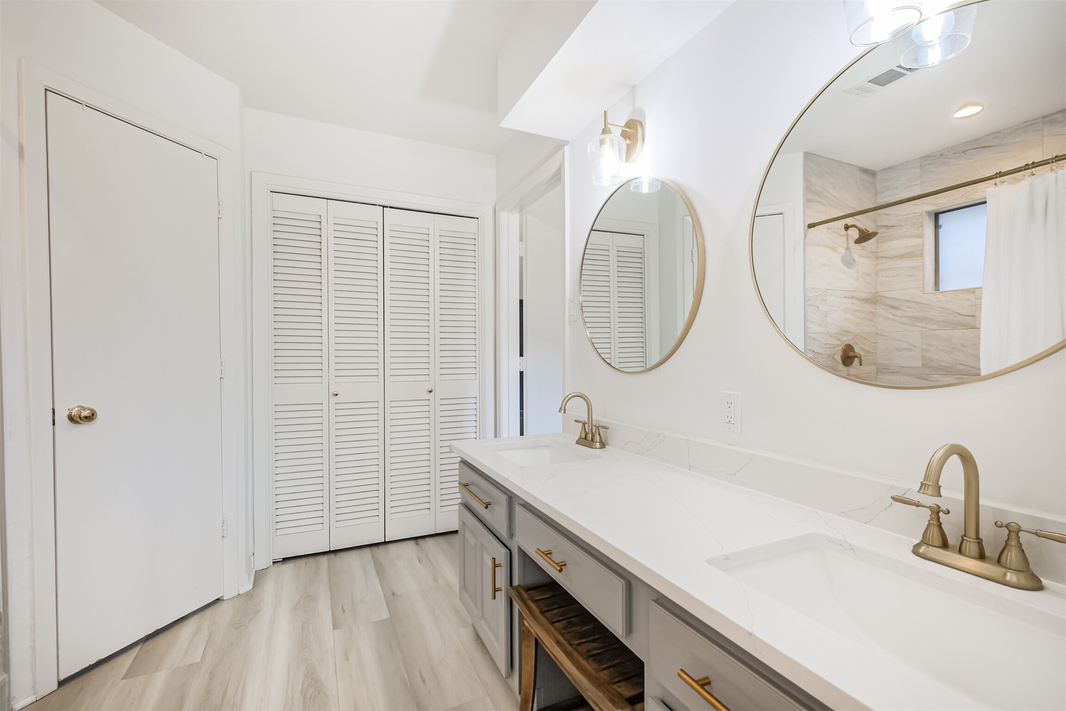 The primary has two walk-in closets and a linen closet.