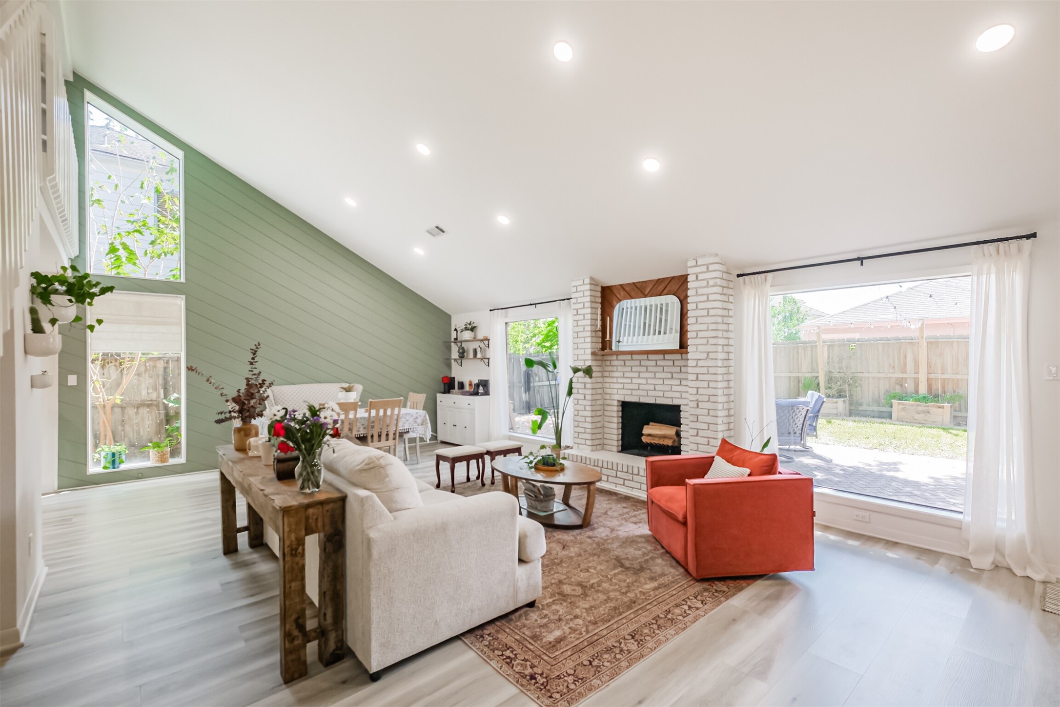 The family room has high ceilings, LED recessed lighting and a fireplace.