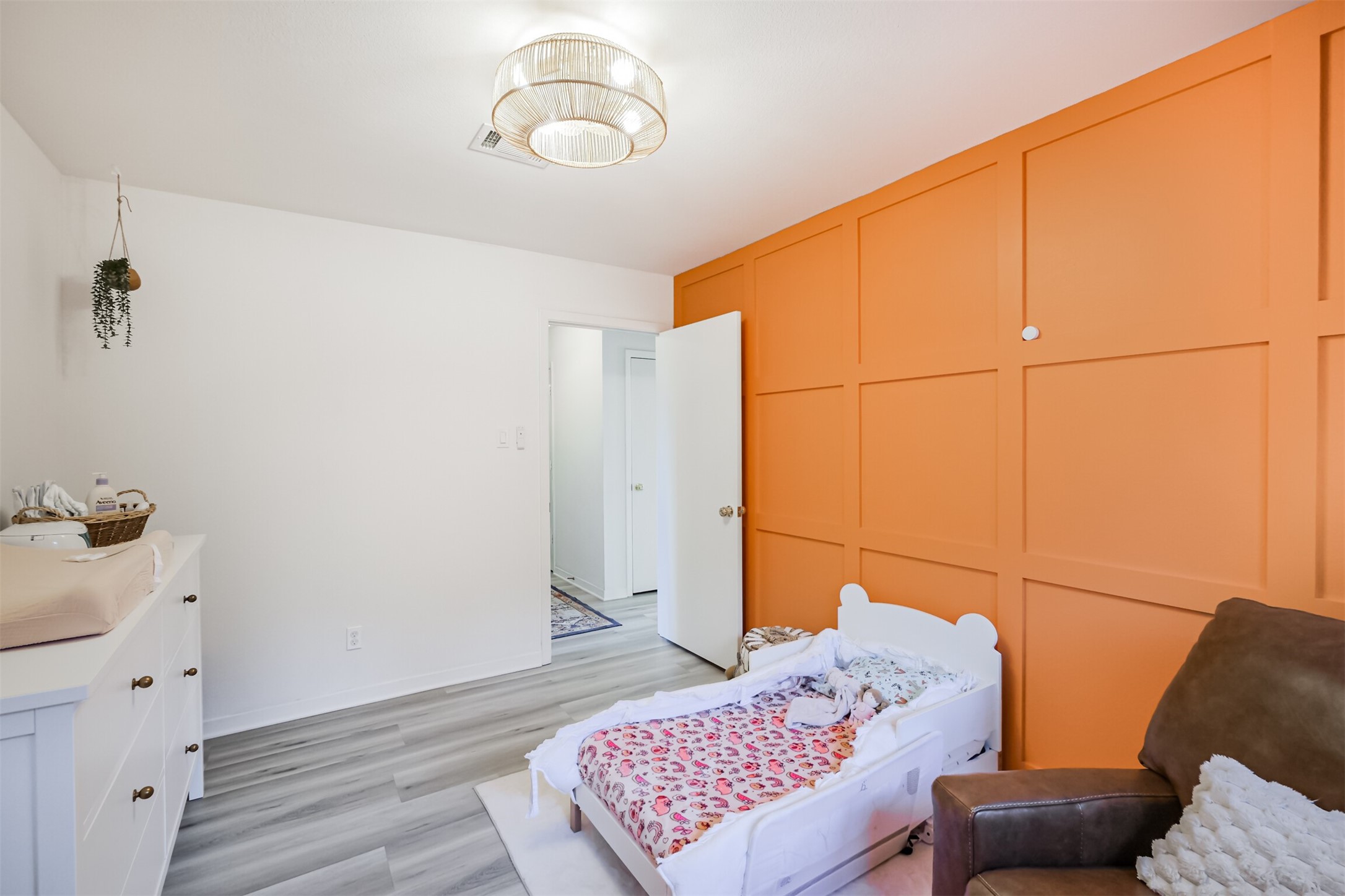 Bedroom #2 has laminate floors and an updated light fixture.