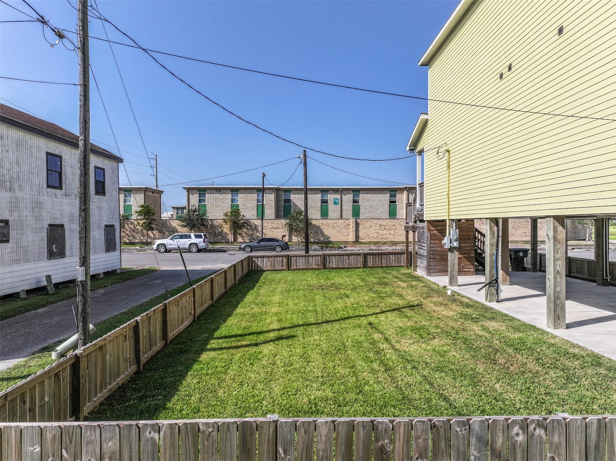 View of the lot from the alley. View of the lot from the alley.
