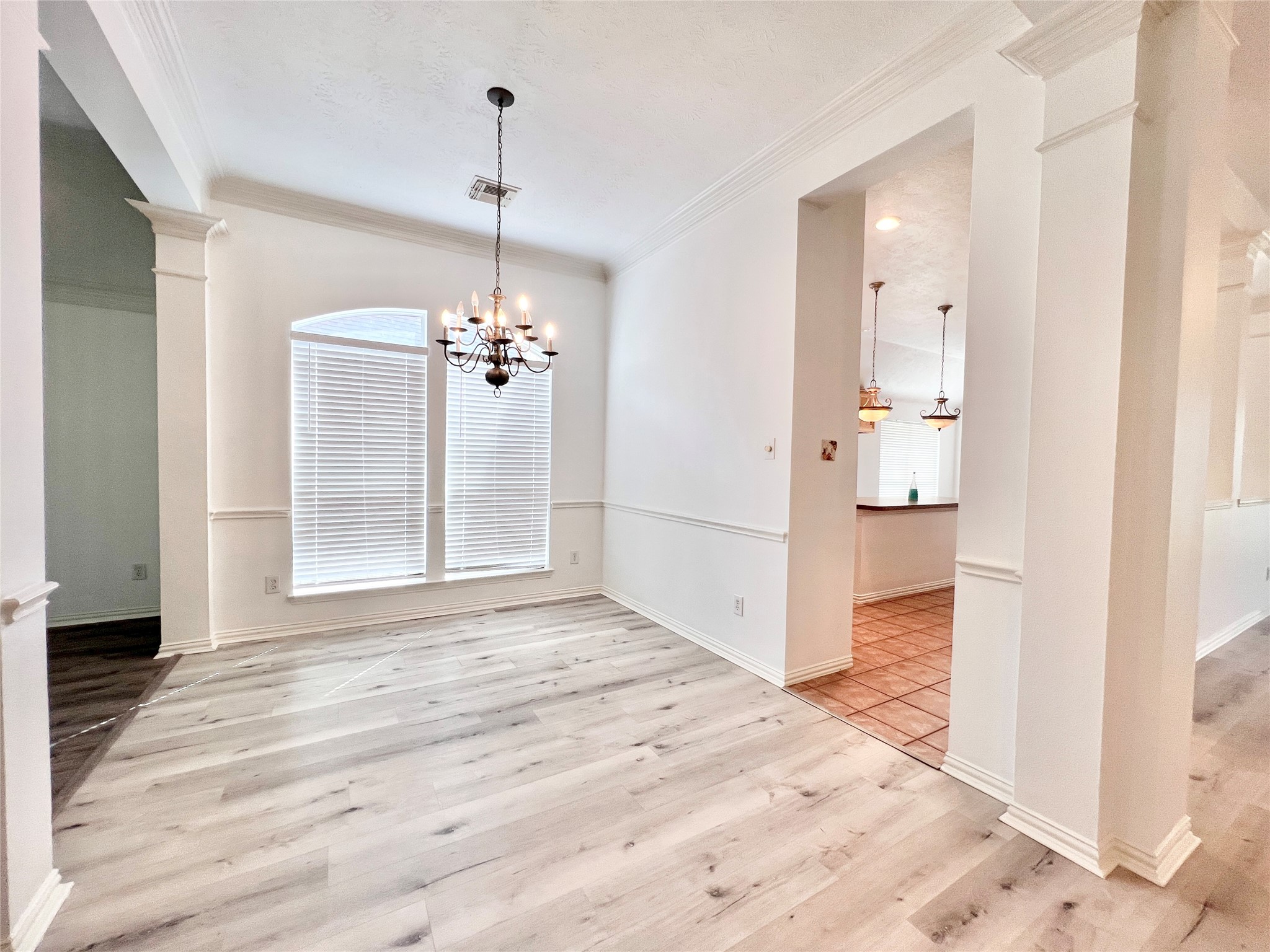Dining room with a passage to kitchen