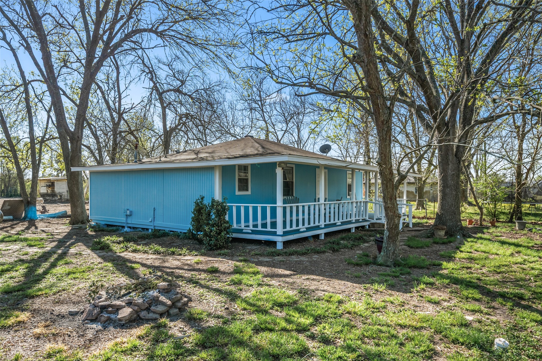 Side angle of house showing lots of trees