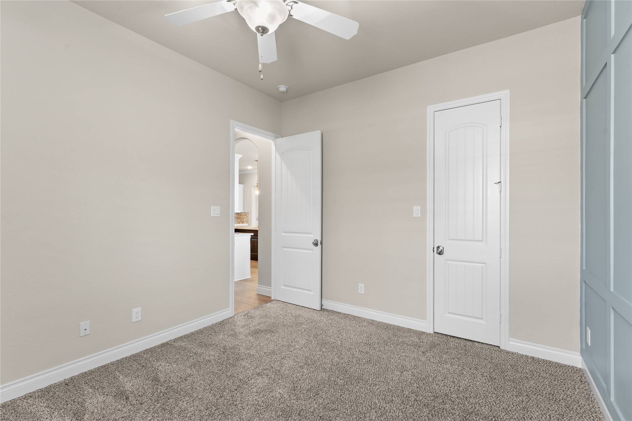 Natural light fills this secondary bedroom