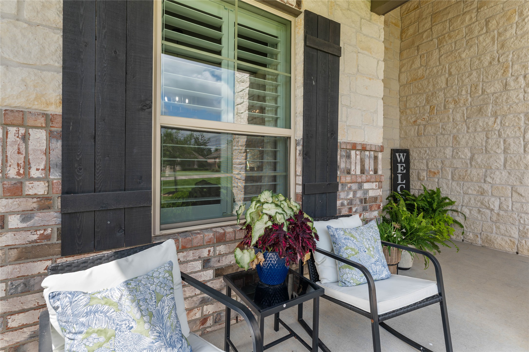 Covered front porch offers a welcoming place to relax and unwind