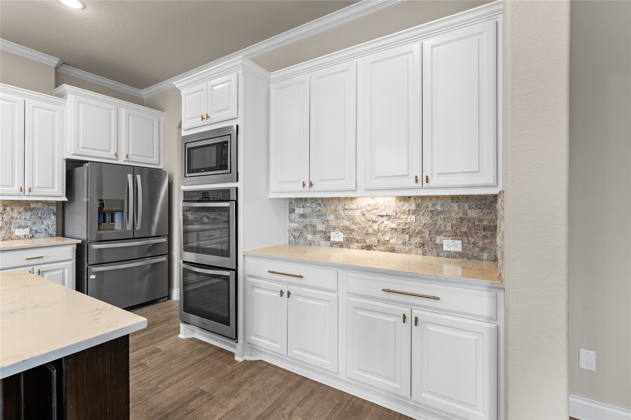 Timeless kitchen design with double ovens and ample counter space