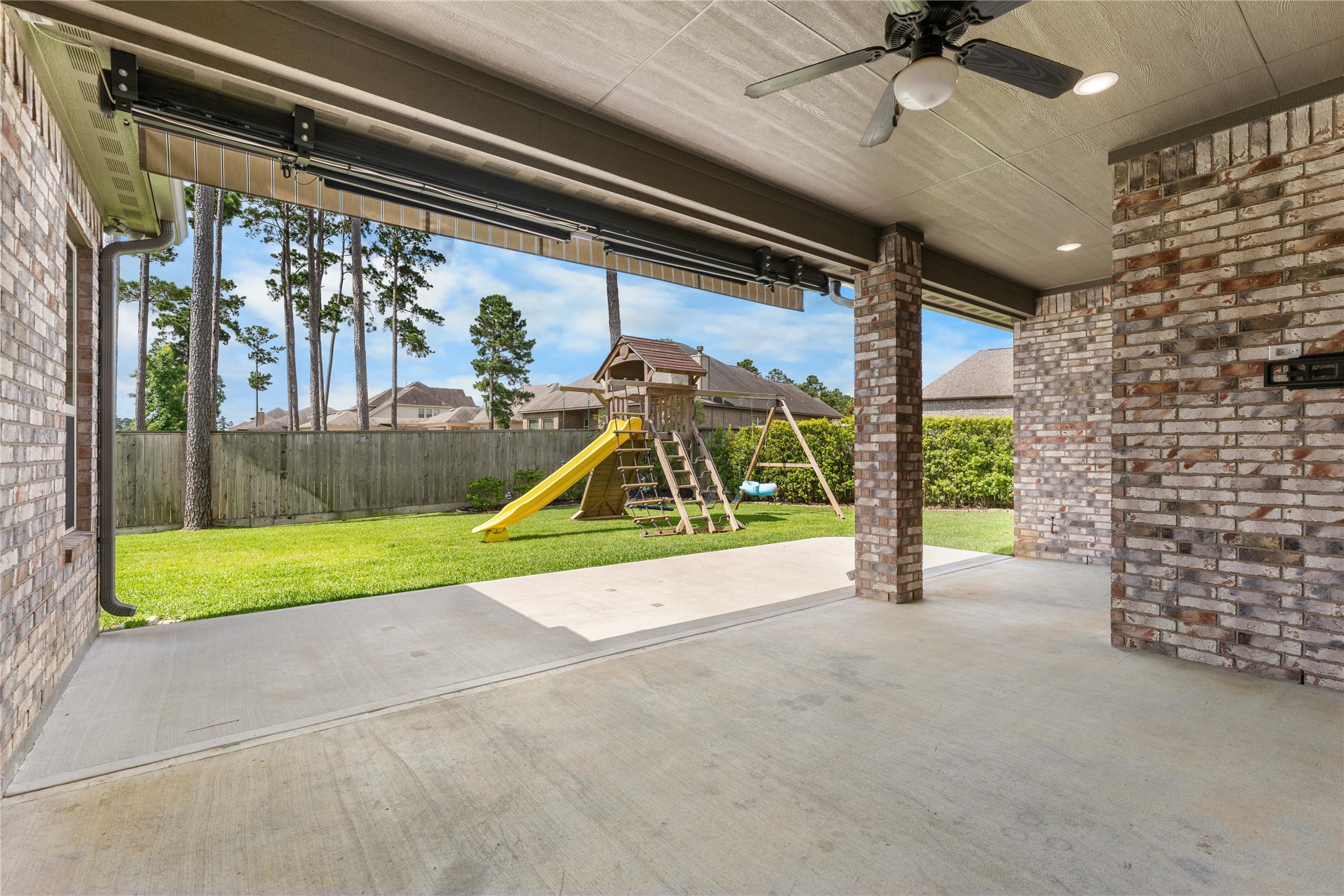 Covered back patio perfect for outdoor dining and entertaining year-round.
