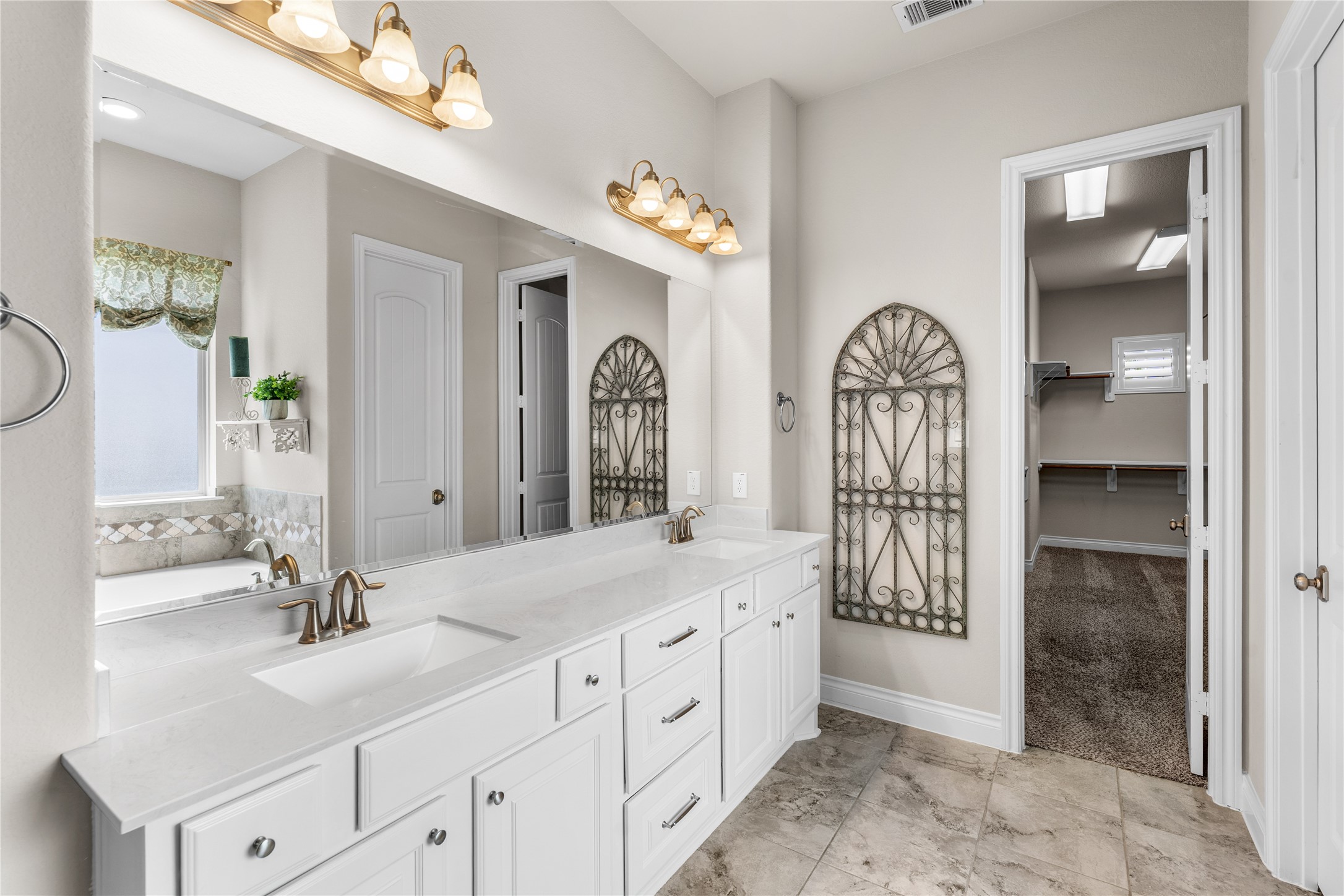 Elegant primary bathroom designed for comfort and functionality.