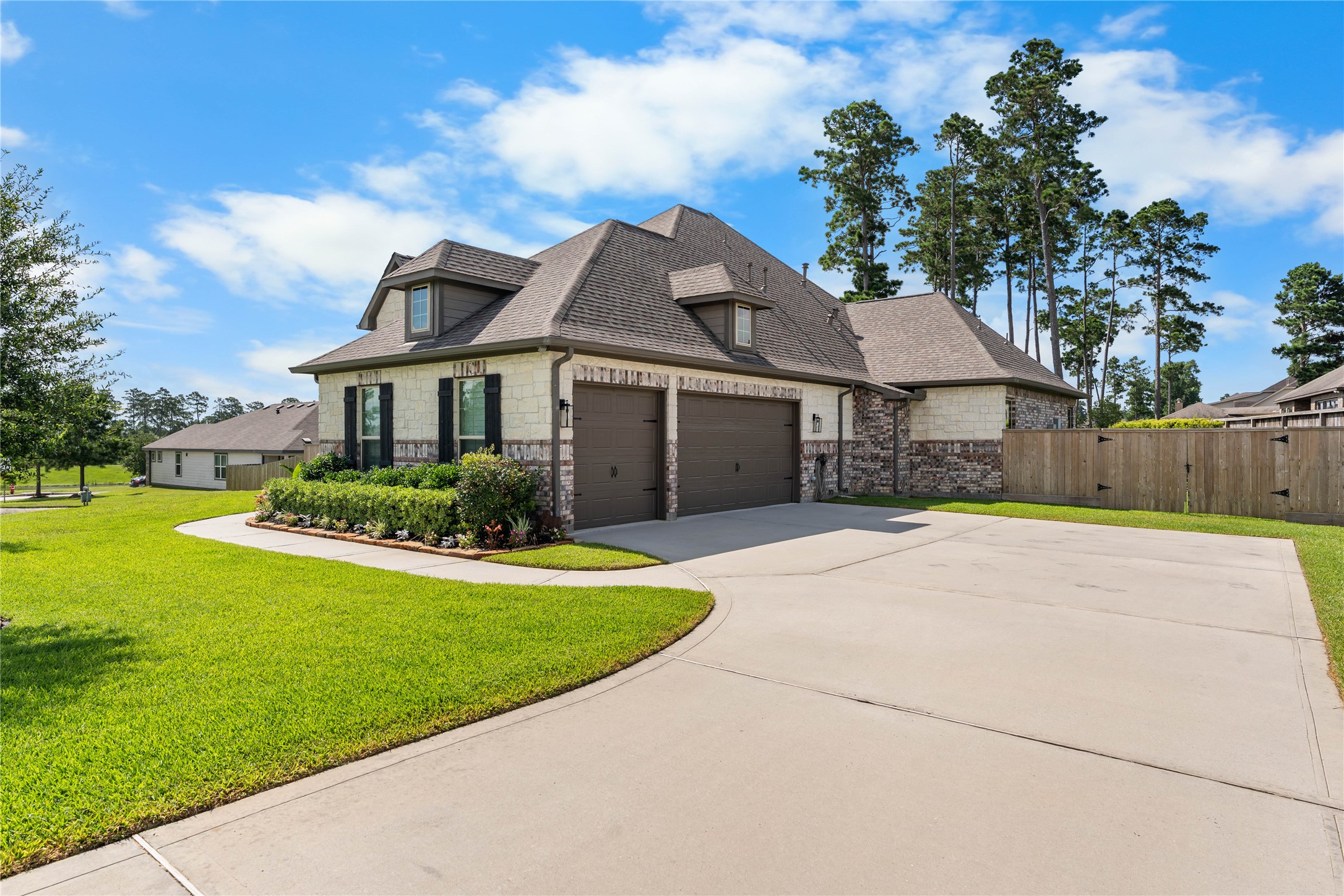 Extended driveway and side-entry garage create a polished first impression