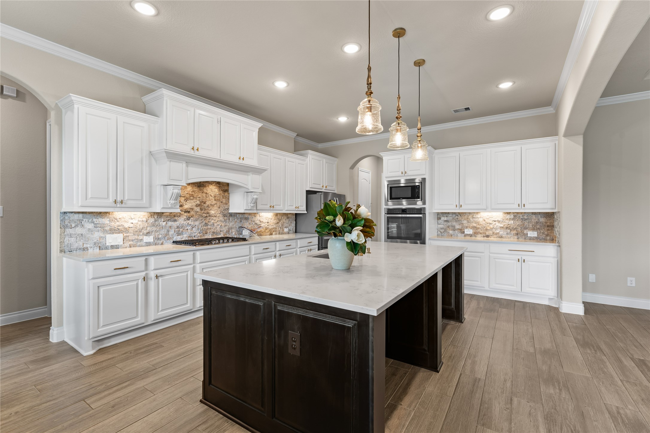 Bright chefs kitchen featuring extensive cabinetry and open sightlines