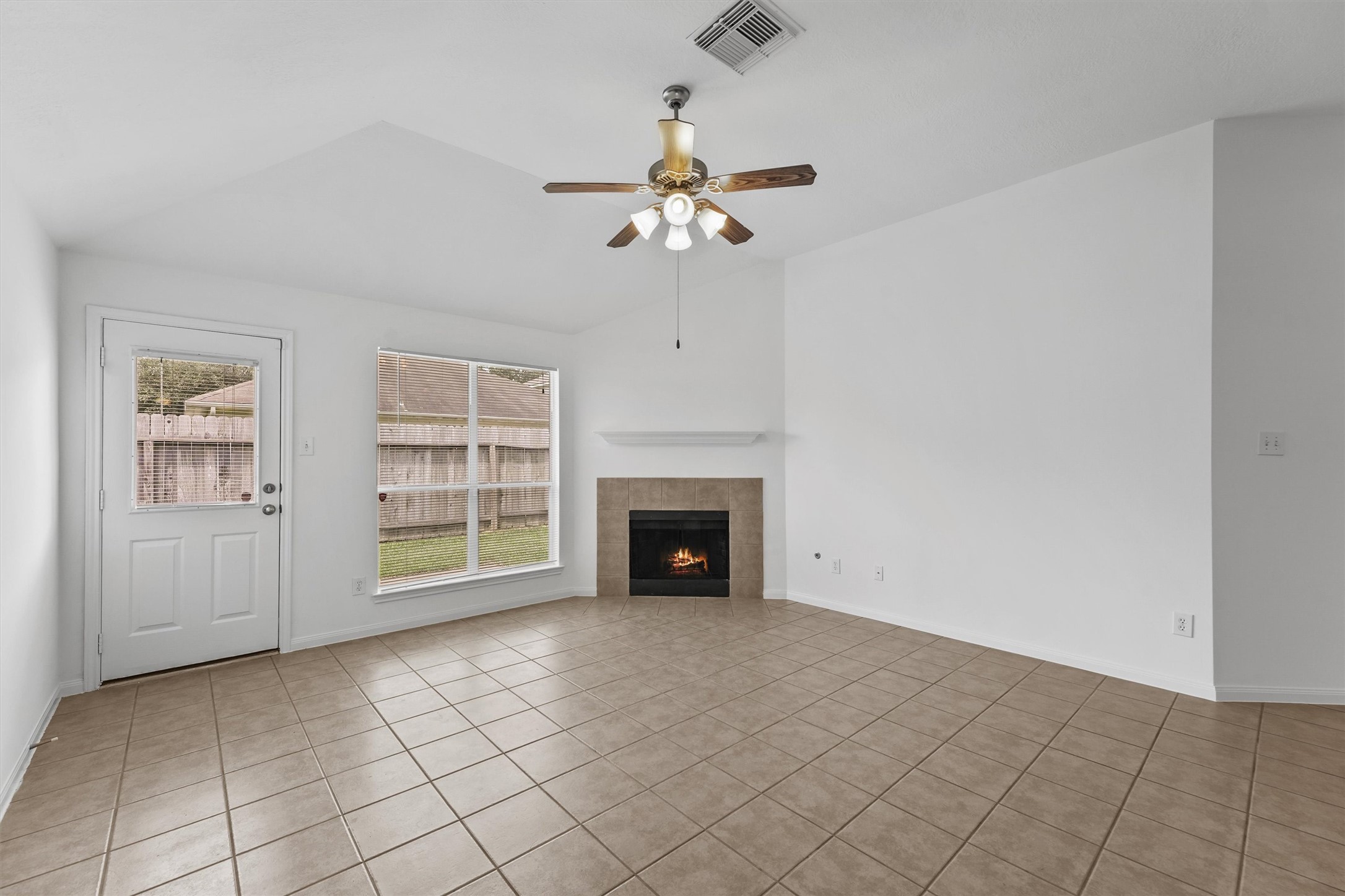 There is NO CARPET in this home. But there is a fireplace and high ceilings.
