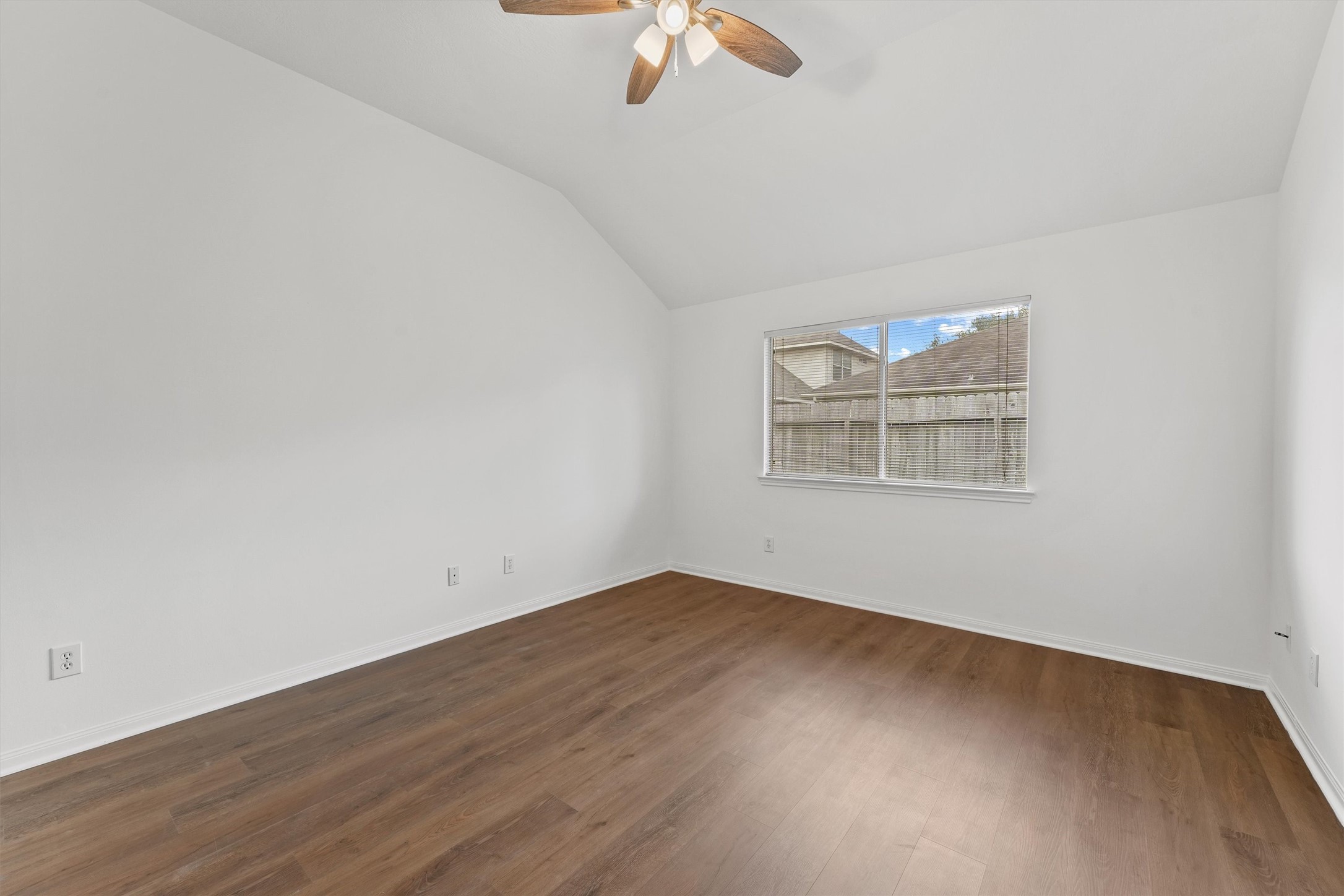The primary bedroom has new floors and a raised ceiling.