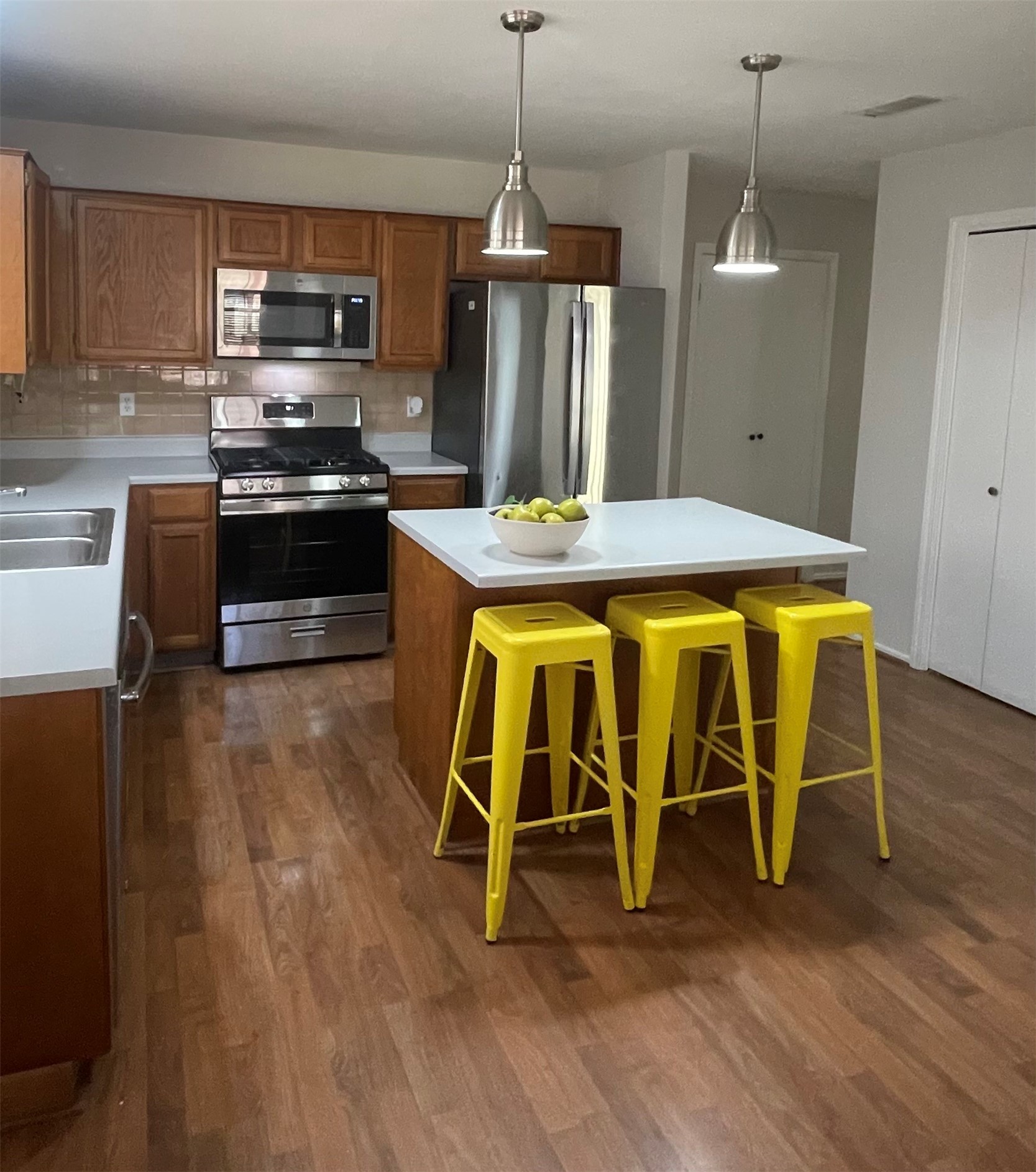 Kitchen with Island and stainless appliances Kitchen with Island and stainless appliances