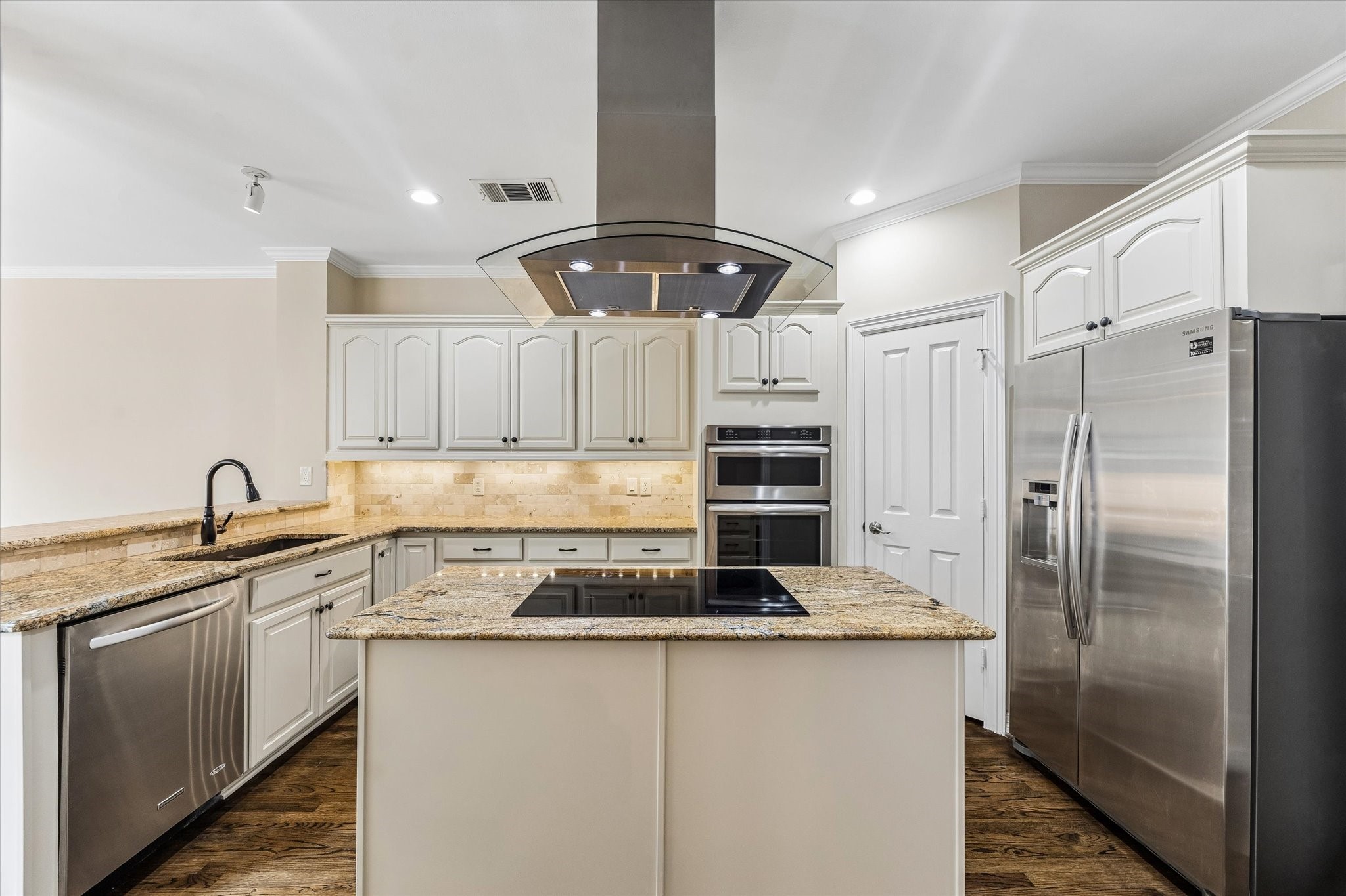 Kitchen with SS appliances.