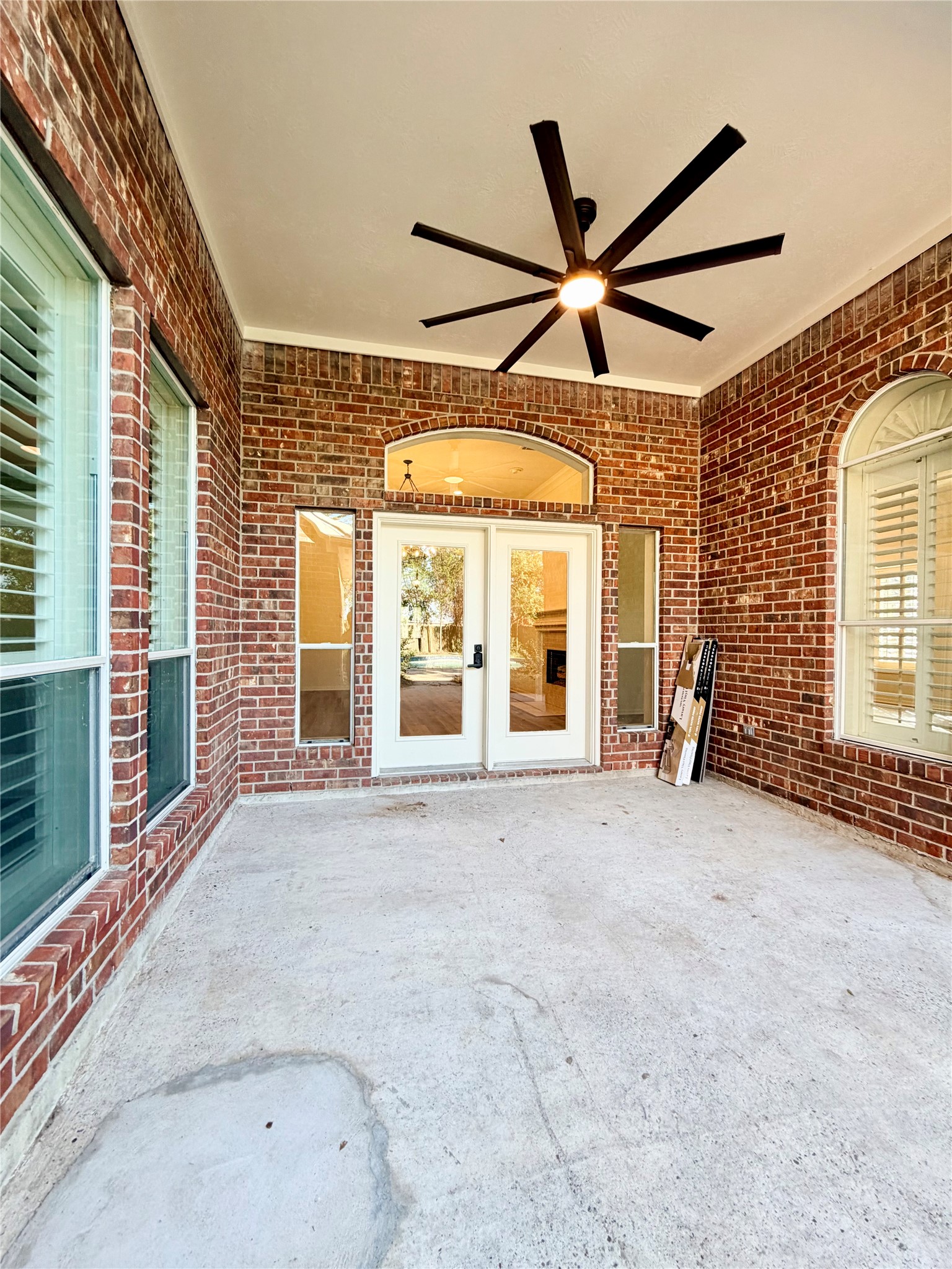 Covered back porch w/ a new 72 in ceiling fan.  There is more space around the pool for additional patio furniture and/ot pool loungers