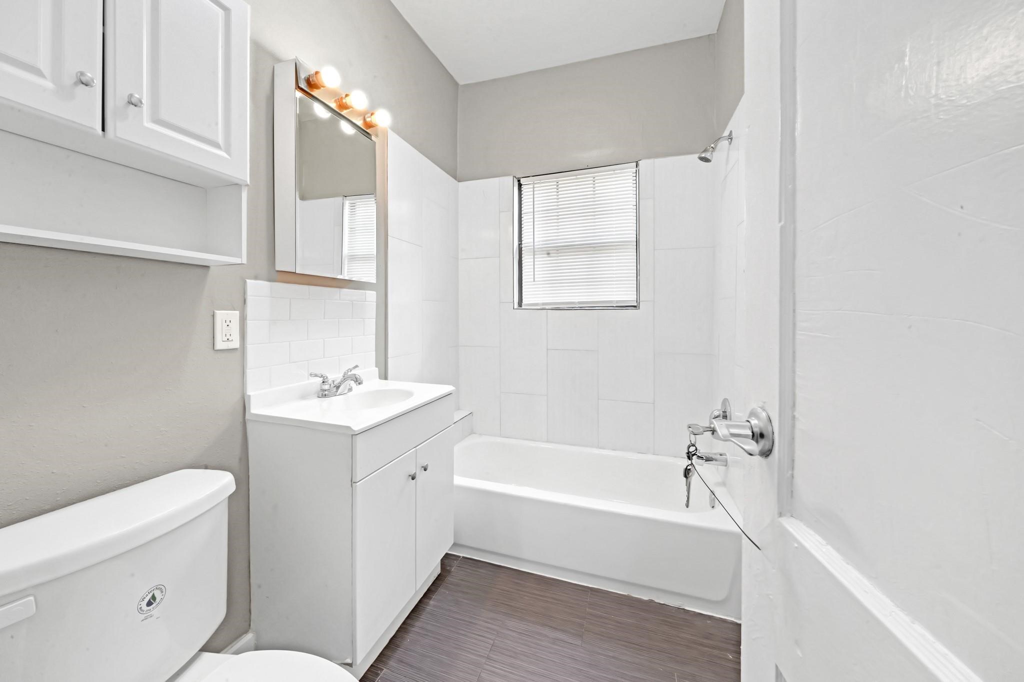 Full bathroom featuring a shower and tub combination.