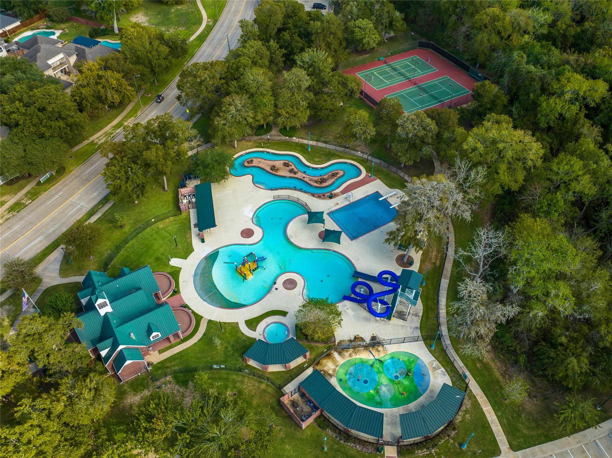 FROM KIDDIE SPLASH ZONES AND TOWERING SLIDES TO SHADED LOUNGING AREAS AND SCENIC WALKING TRAILS, THIS AMENITY-RICH AQUATIC COMPLEX OFFERS FUN FOR ALL AGES.