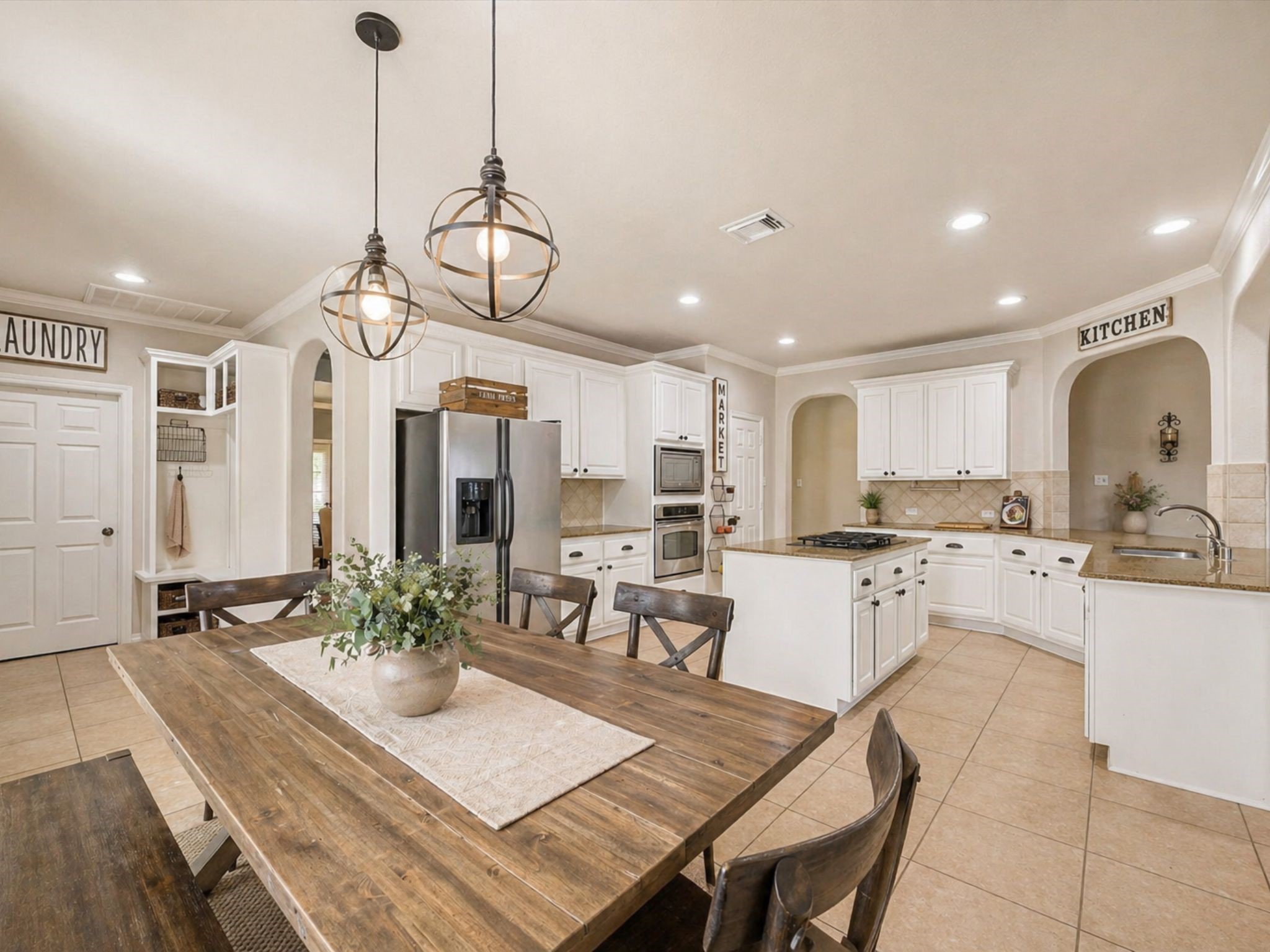 SPACIOUS KITCHEN WITH LARGE ISLAND, AMPLE CABINETRY, AND OPEN CONNECTION TO DINING AREA. **Virtually Staged. SPACIOUS KITCHEN WITH LARGE ISLAND, AMPLE CABINETRY, AND OPEN CONNECTION TO DINING AREA. **Virtually Staged.