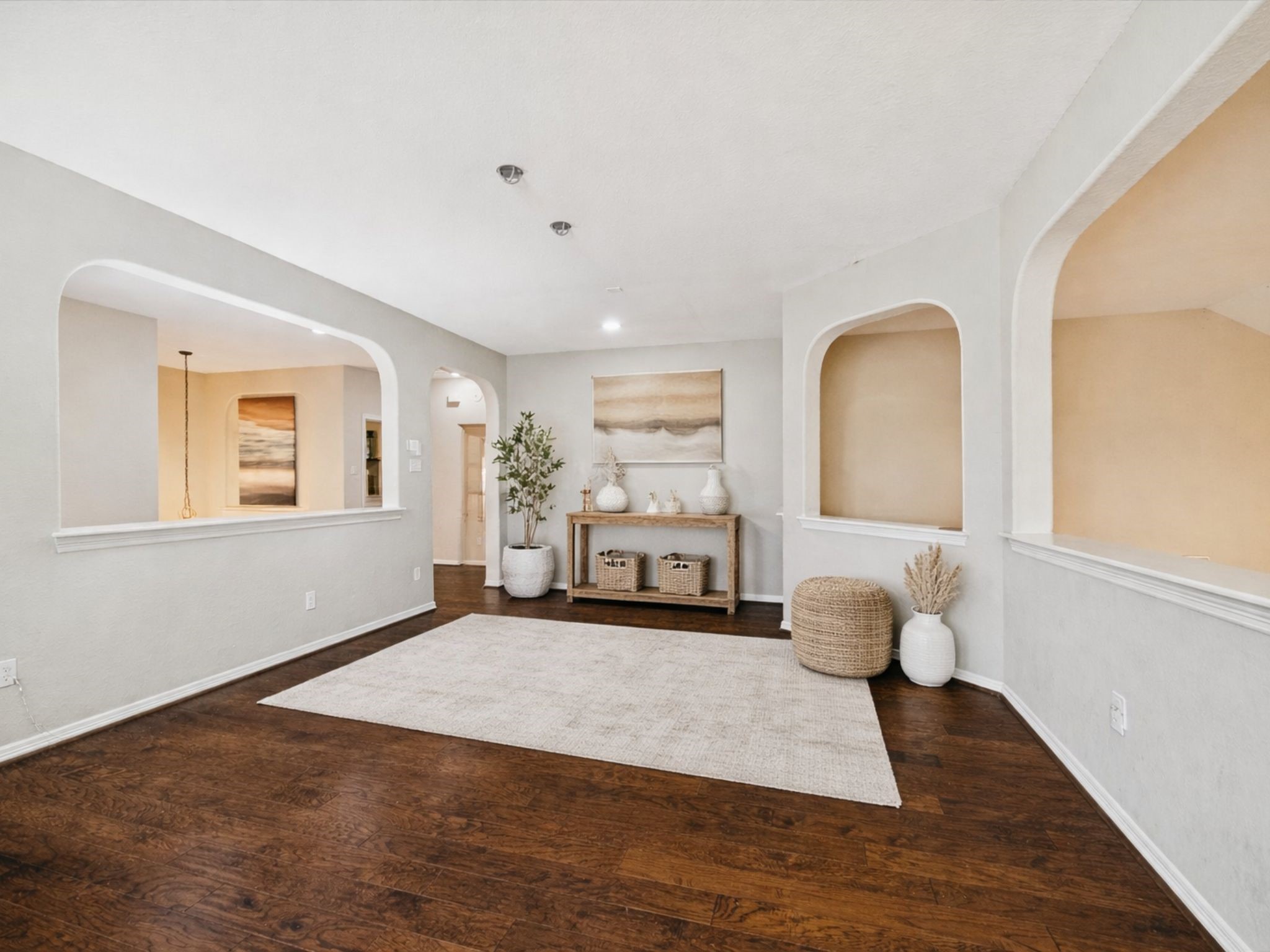 VERSATILE UPSTAIRS OPEN LIVING AREA WITH HARDWOOD FLOORS AND ARCHITECTURAL CUT-OUTS ADDING CHARACTER. **Virtually Staged.