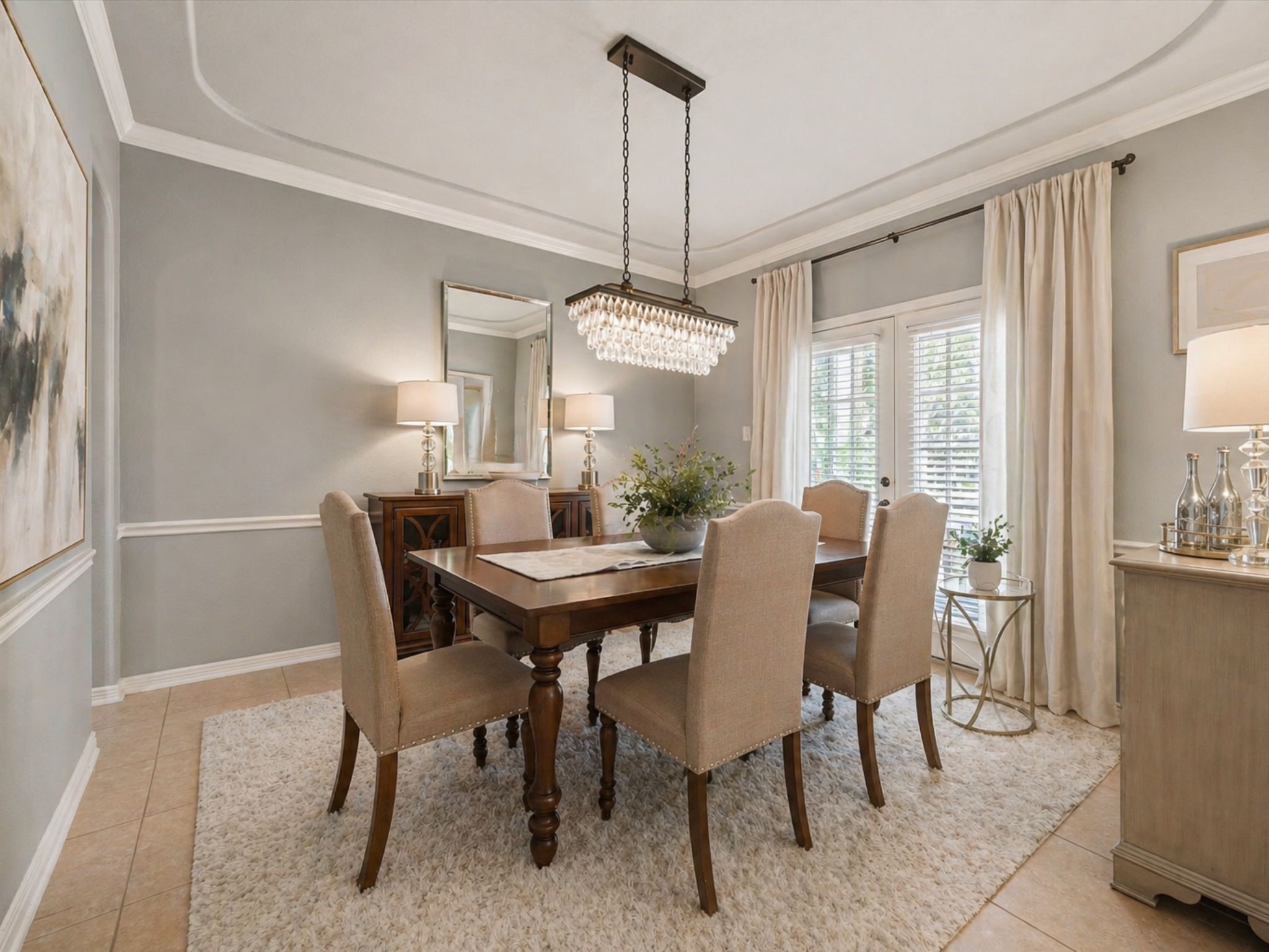 ELEGANT FORMAL DINING ROOM WITH TRAY CEILING AND LARGE WINDOWS FOR NATURAL LIGHT. A PERFECT SETTING FOR ENTERTAINING. **Virtually Staged. ELEGANT FORMAL DINING ROOM WITH TRAY CEILING AND LARGE WINDOWS FOR NATURAL LIGHT. A PERFECT SETTING FOR ENTERTAINING. **Virtually Staged.