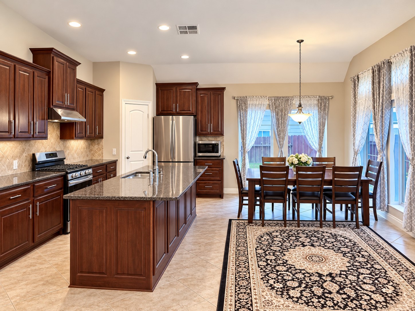 Kitchen facing backyard and open to Breakfast and living room
