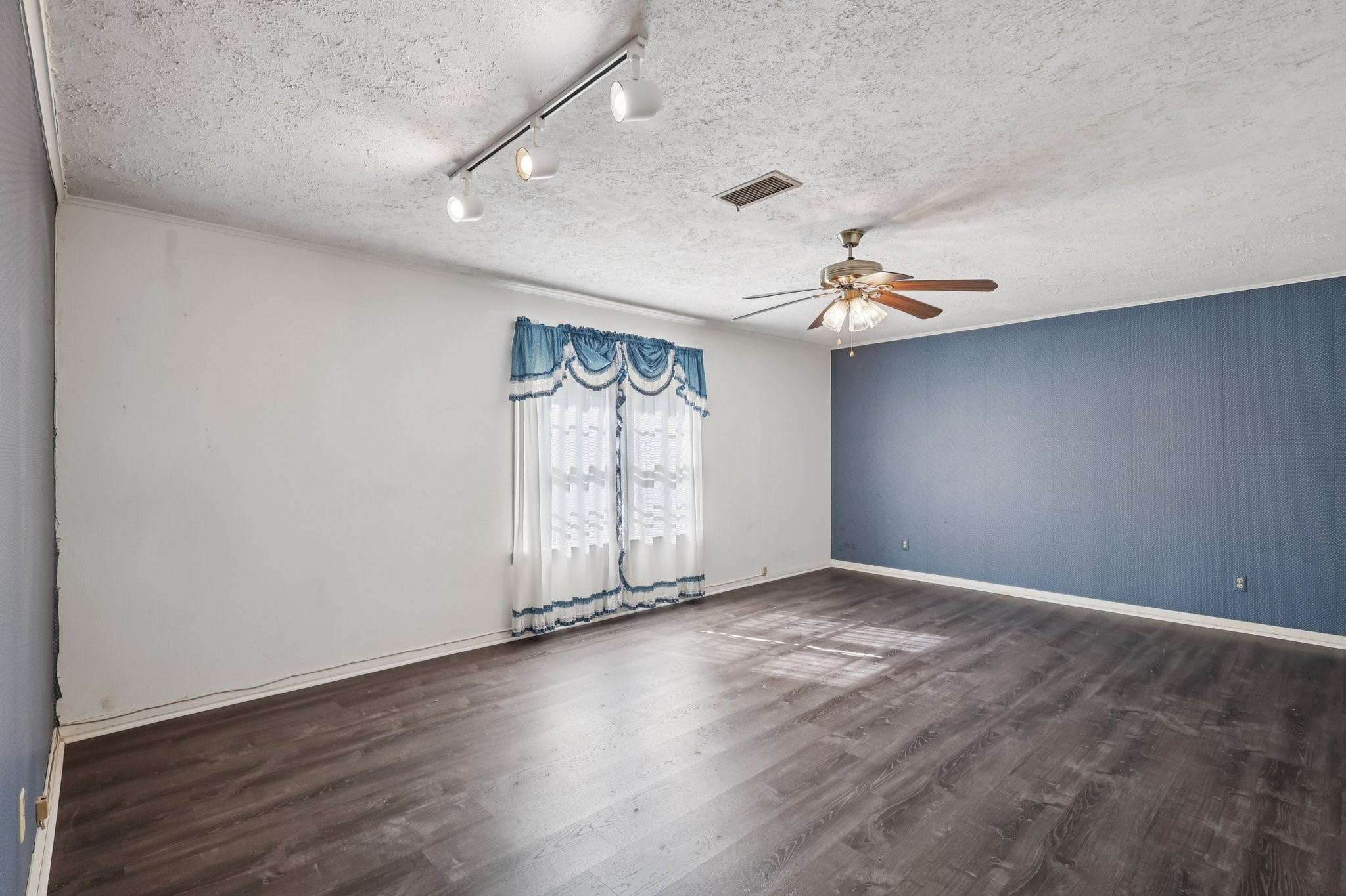The first floor primary suite is massive and features separate closets and an en-suite bath.