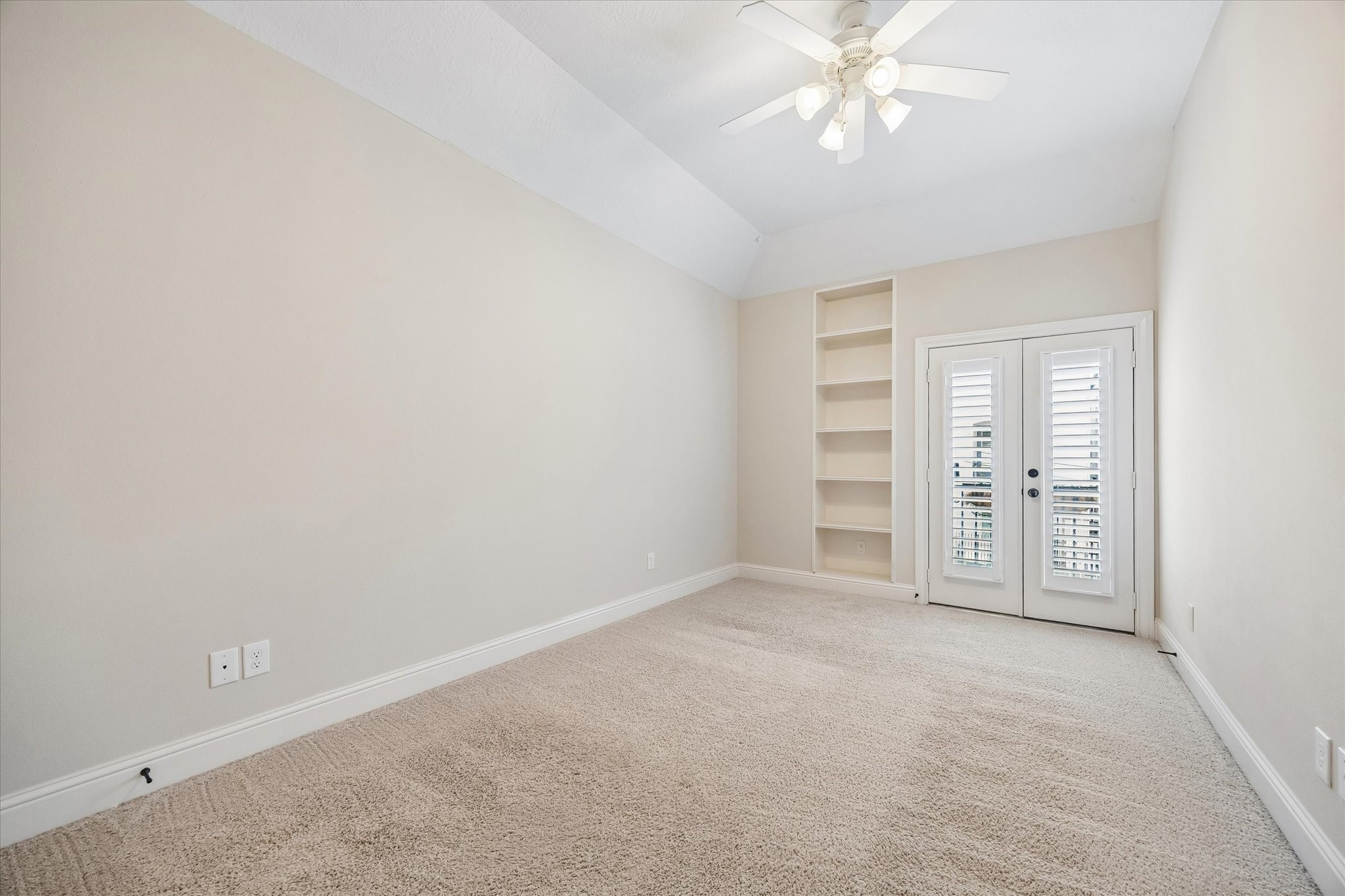 Bright bedroom retreat featuring generous space and custom built-ins.
