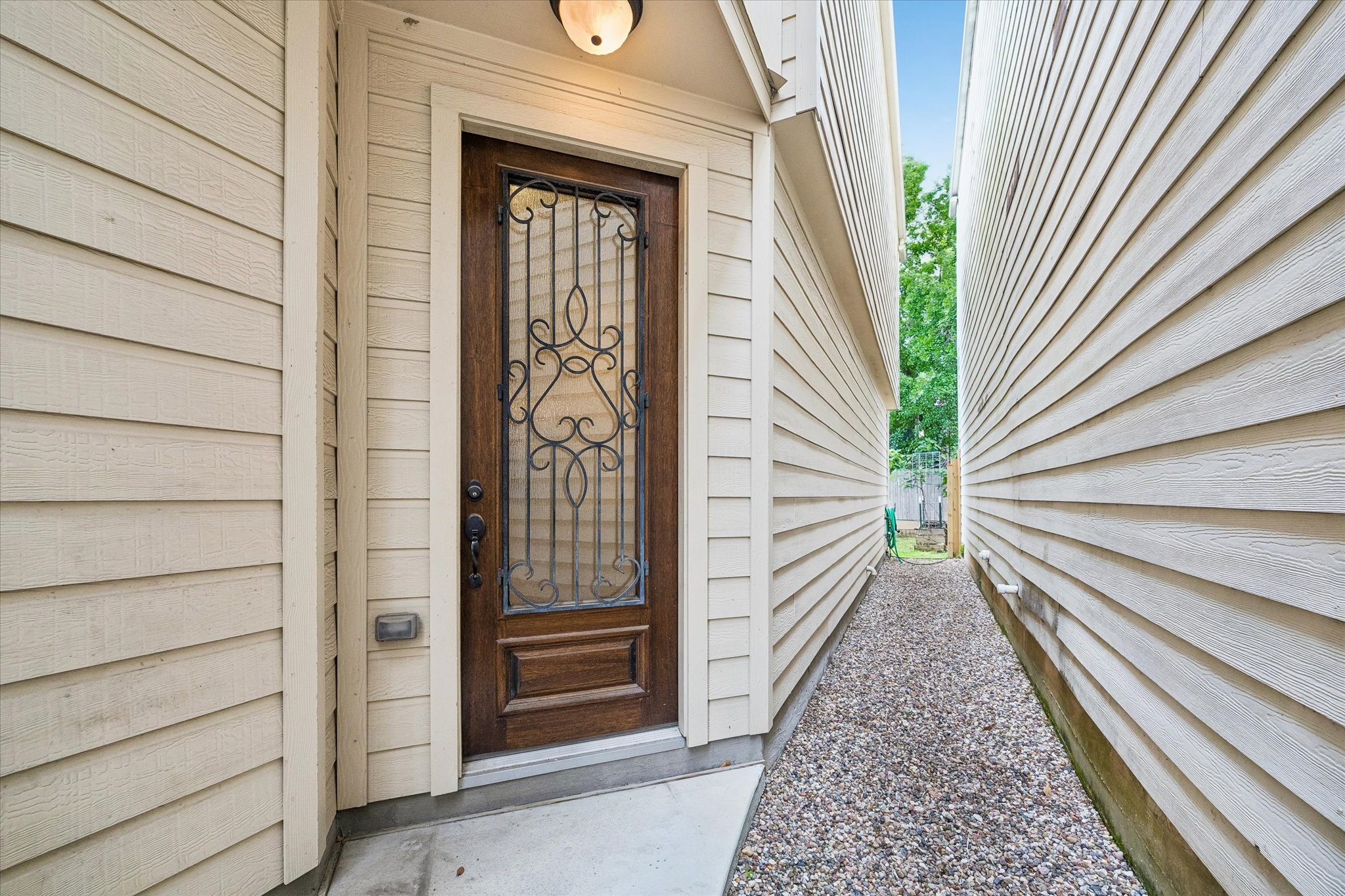Private covered entryway offering charm and added privacy.