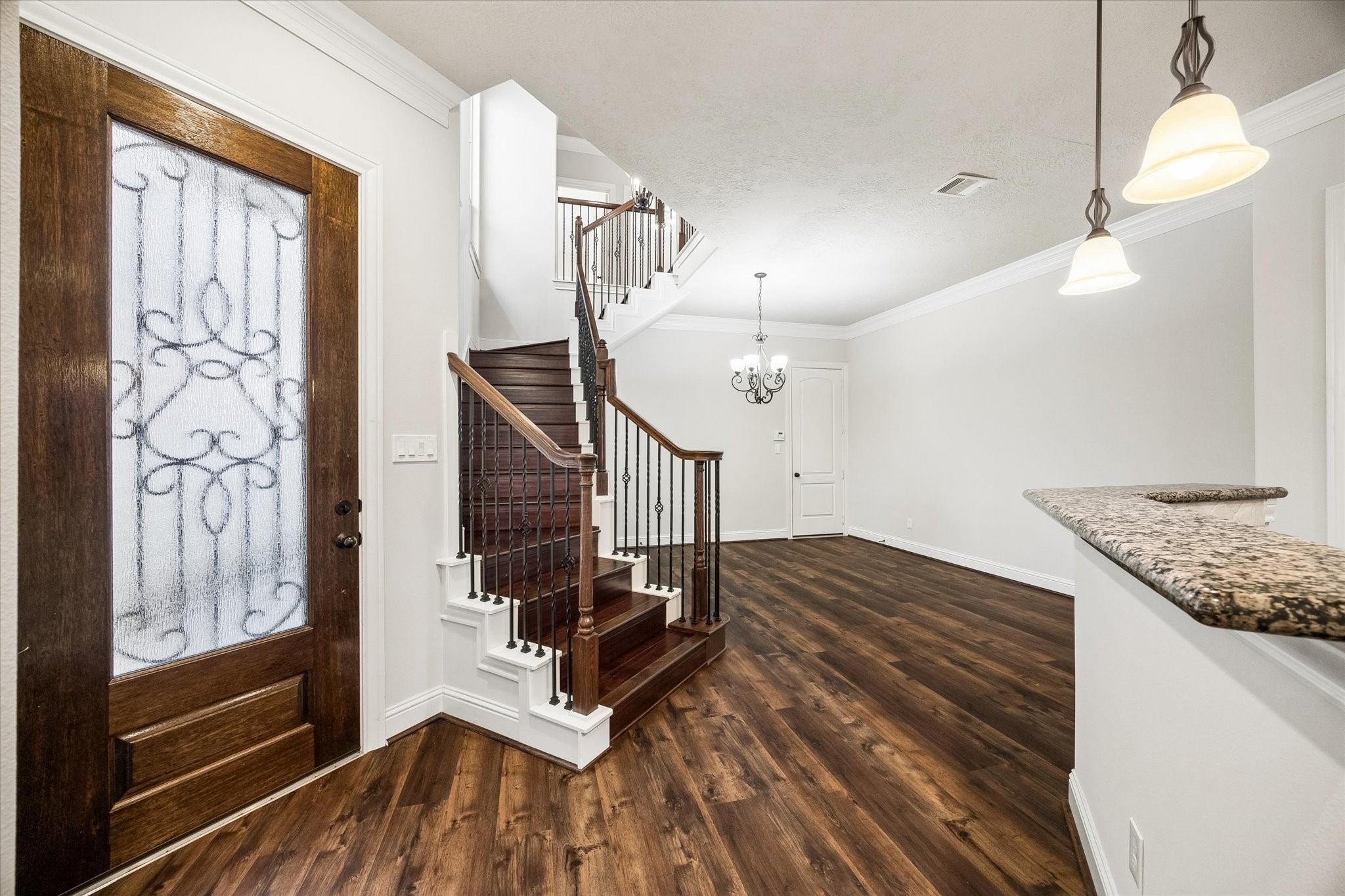 Bright foyer and dining area with seamless flow to the kitchen.