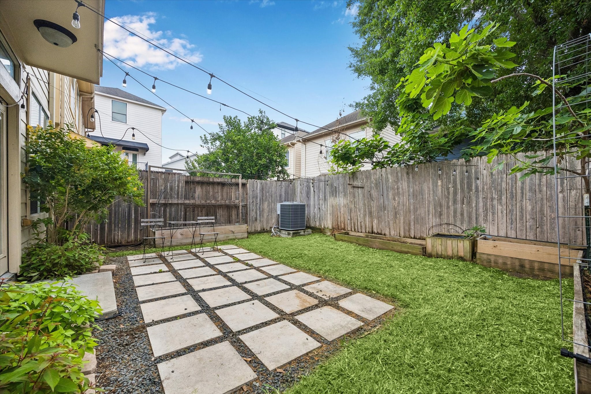 Private backyard with patio, green space, and room to entertain outdoors.