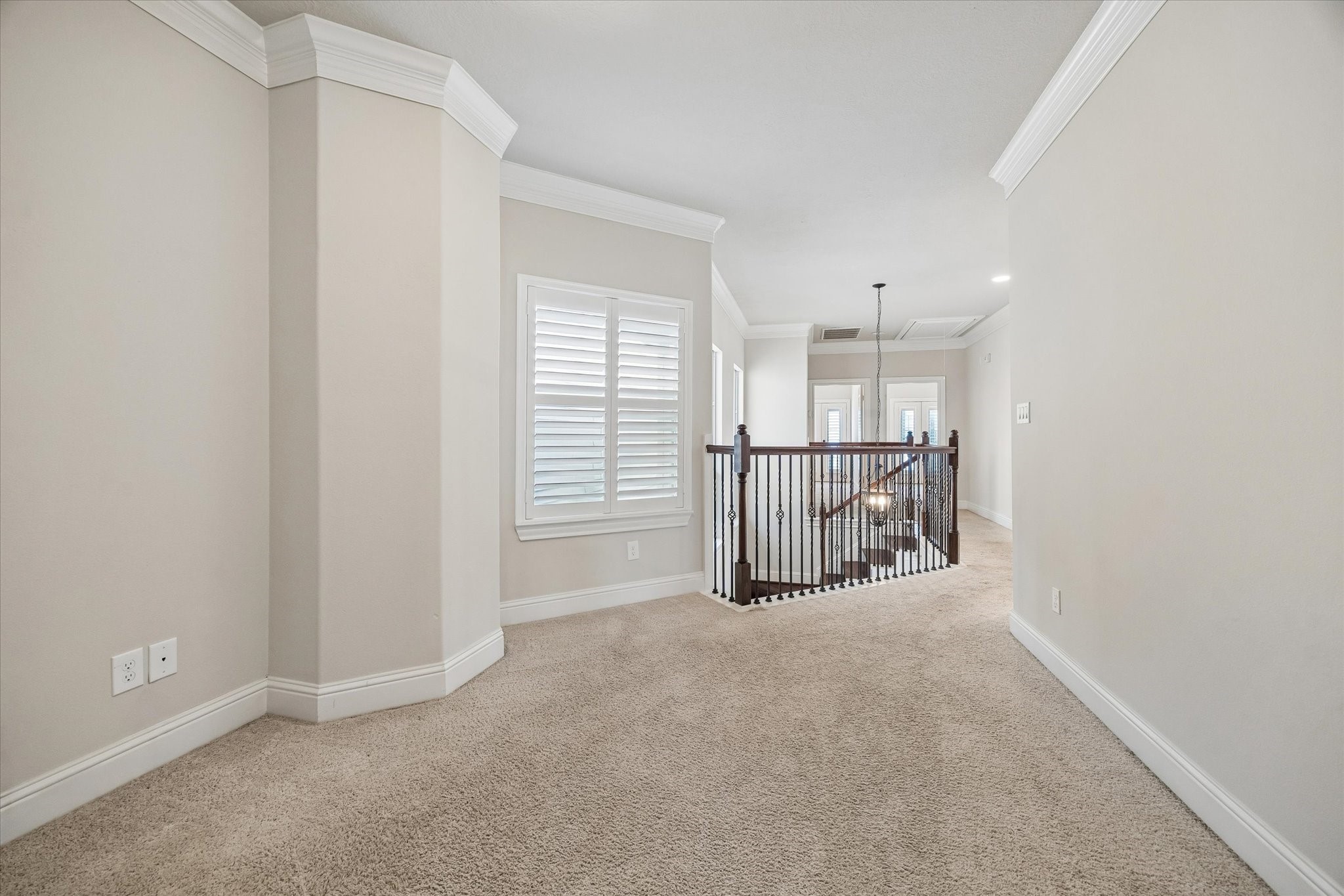 Open upper-level bonus area with natural light and spacious layout.