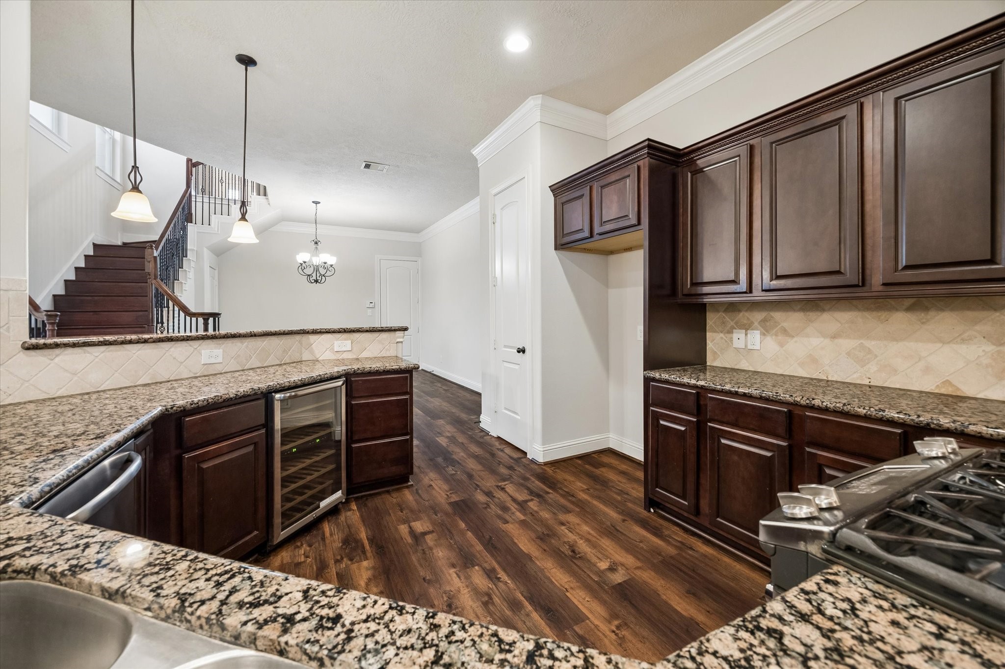 Functional kitchen layout with extensive storage and prep areas.