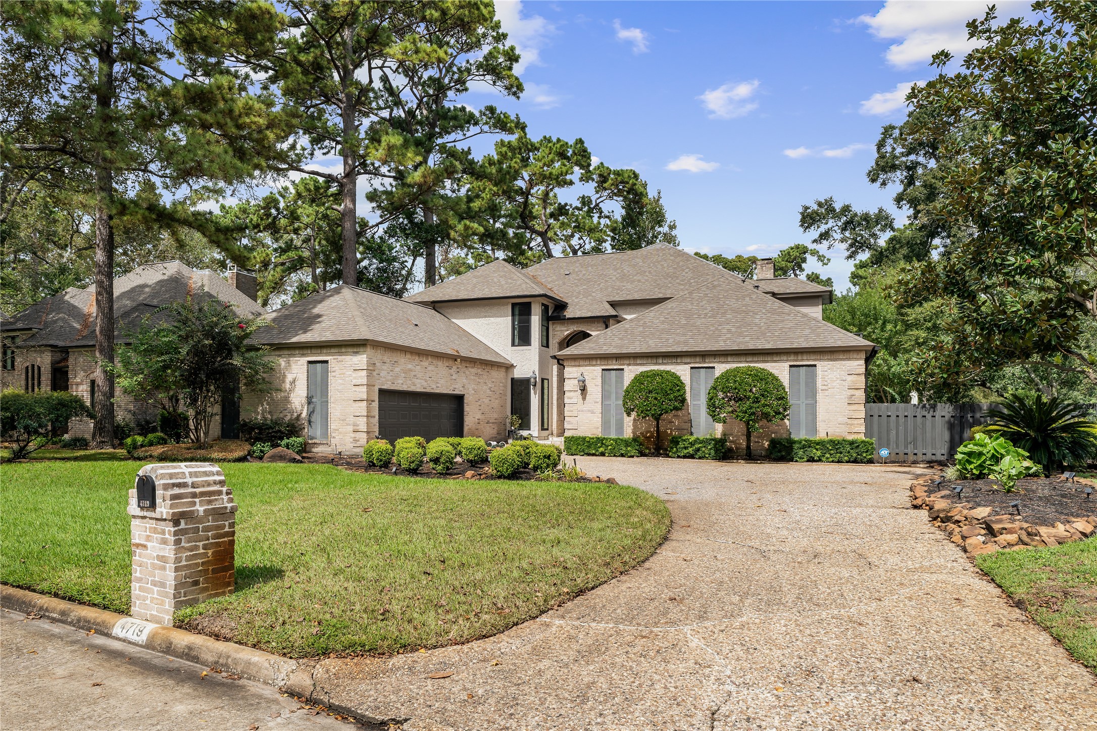 Exceptional curb appeal welcomes you home, with a sweeping driveway, stately brick faade, and the added privacy of having neighbors on only one side.
