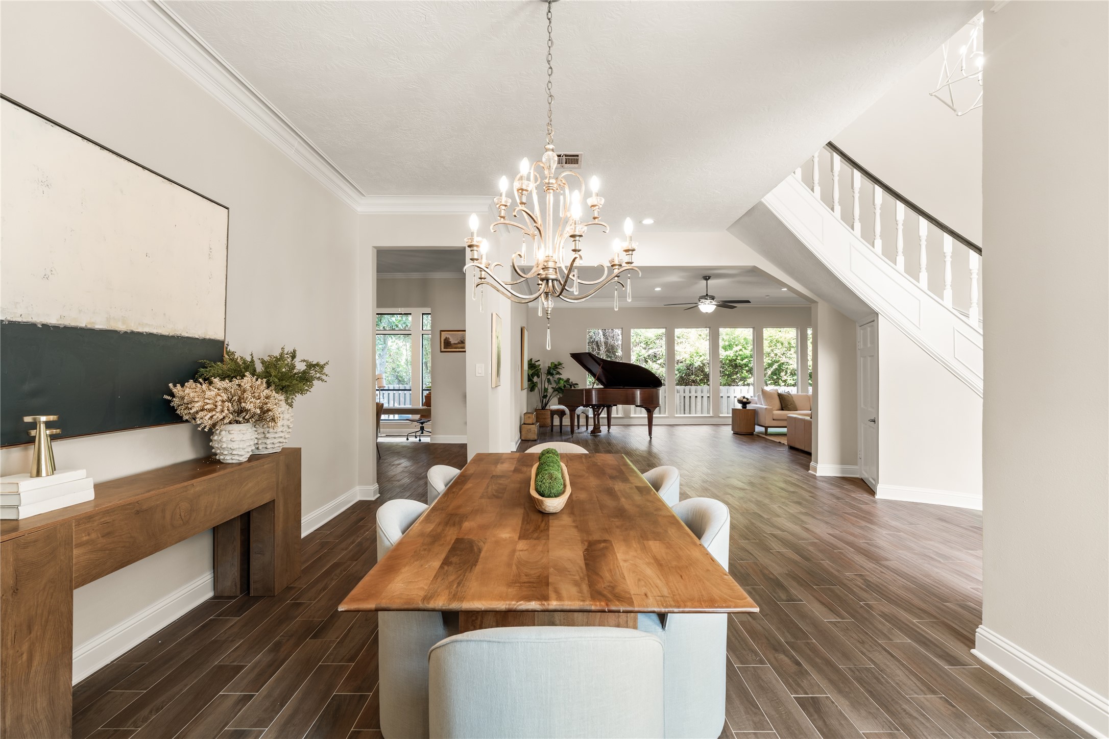 Gracious proportions and refined architectural details create an elegant transition from the formal dining room into the expansive living space, perfectly suited for sophisticated entertaining.