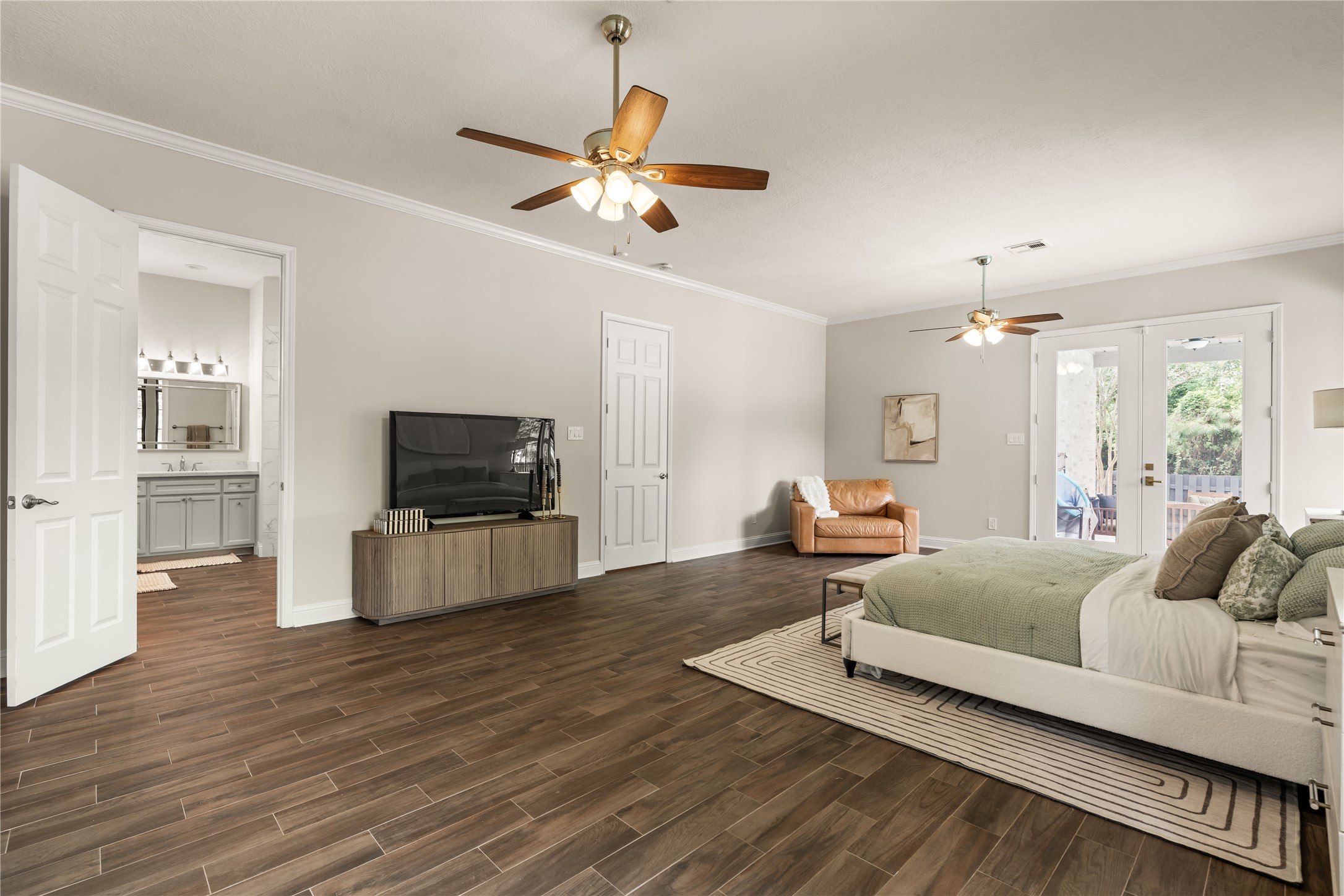 Elegant primary suite offering impressive proportions, an inviting sense of comfort, and seamless connection to the private en-suite.
