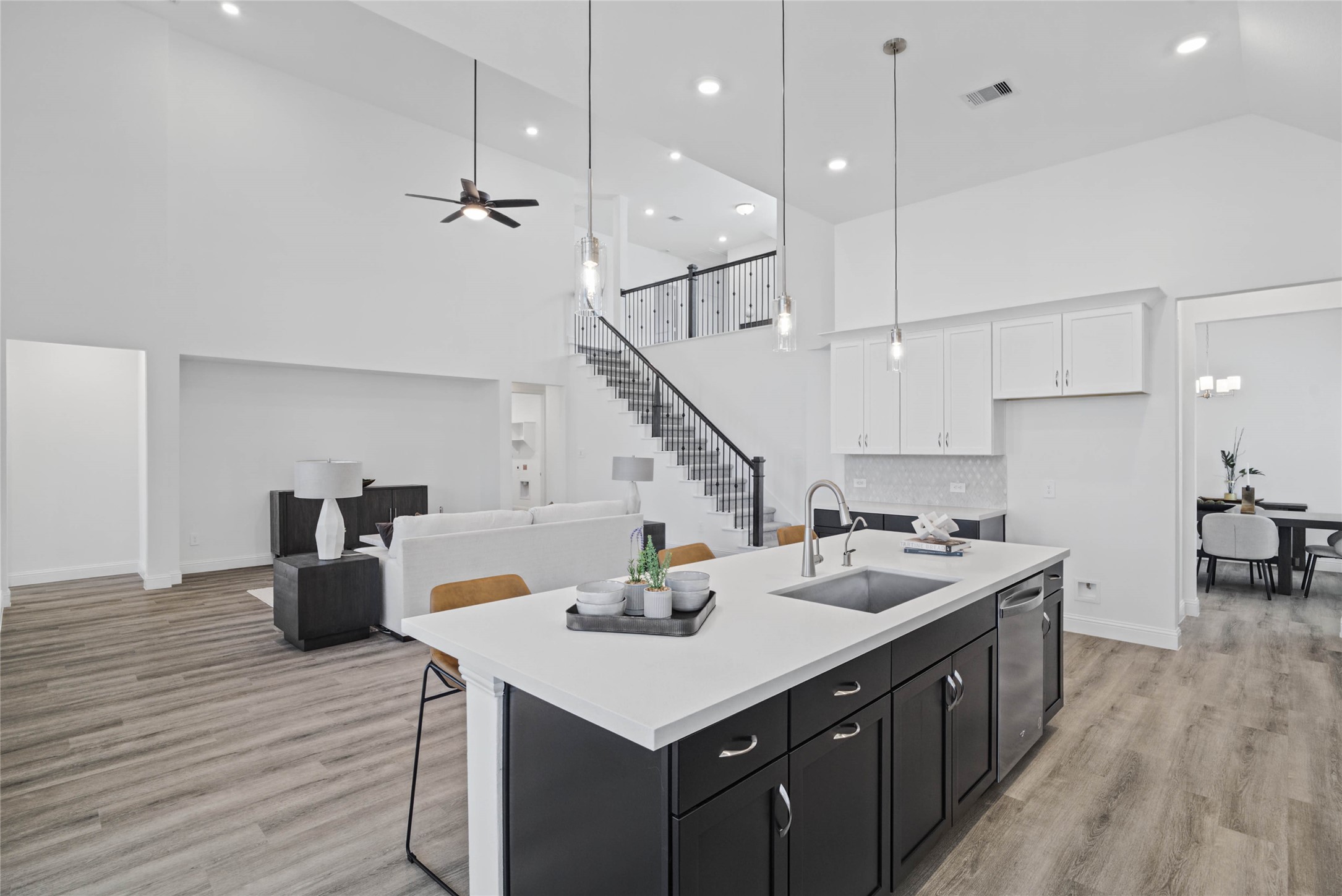 Enjoy commanding sightlines across the oversized kitchen island into the family room and this open-concept layout.