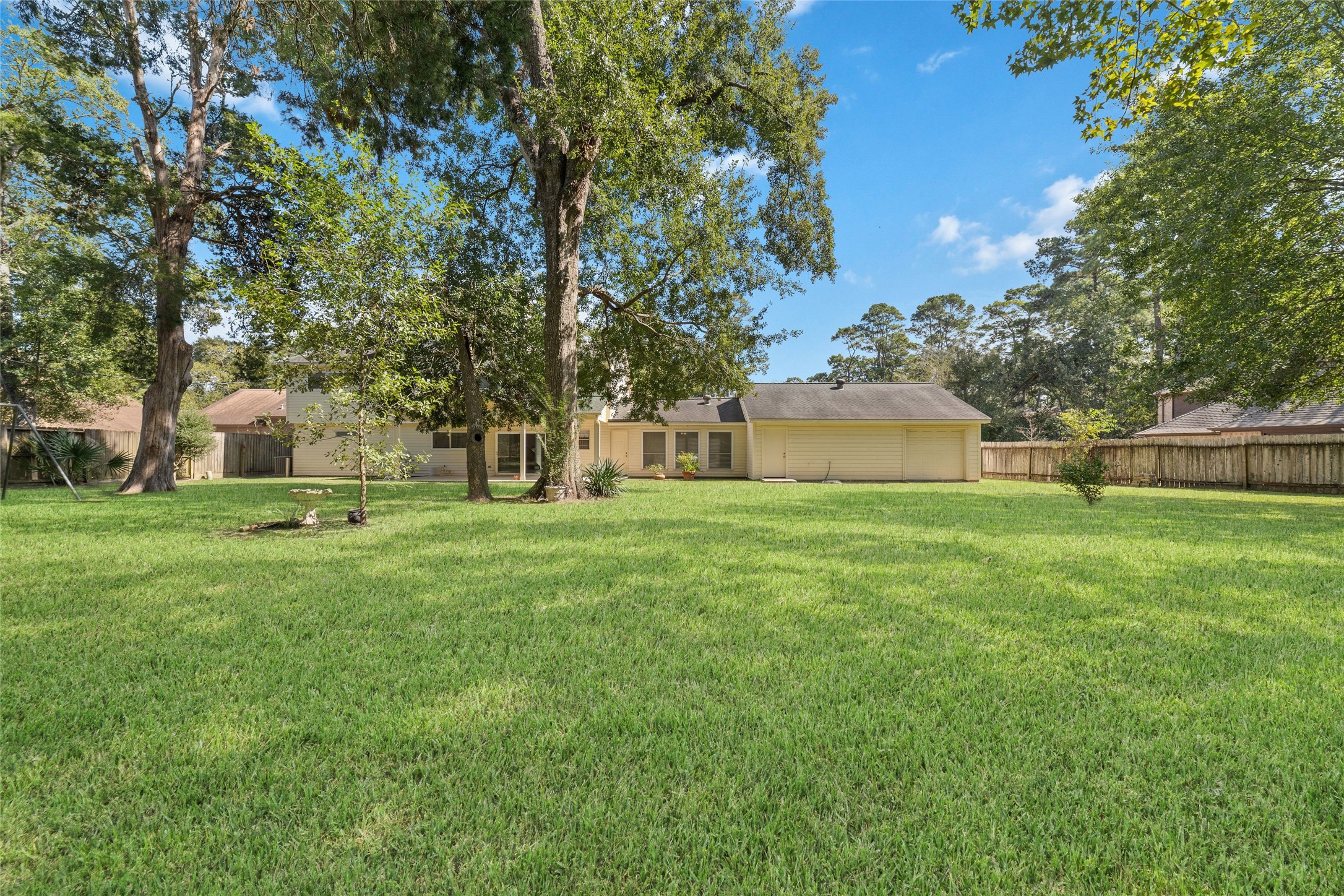 Room to run, play, entertain, or simply unwind! This expansive, tree-shaded backyard offers a beautiful combination of open lawn, towering mature trees, and a peaceful natural setting. Whether it's a game of catch, weekend gatherings, or quiet afternoons outdoors, there's room for everyone to enjoy