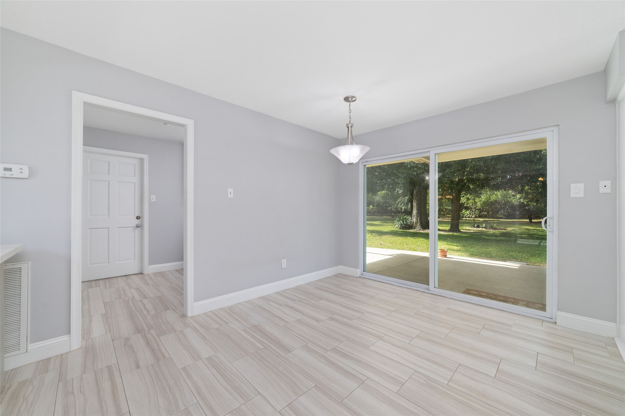 Breakfast room shown unstaged.