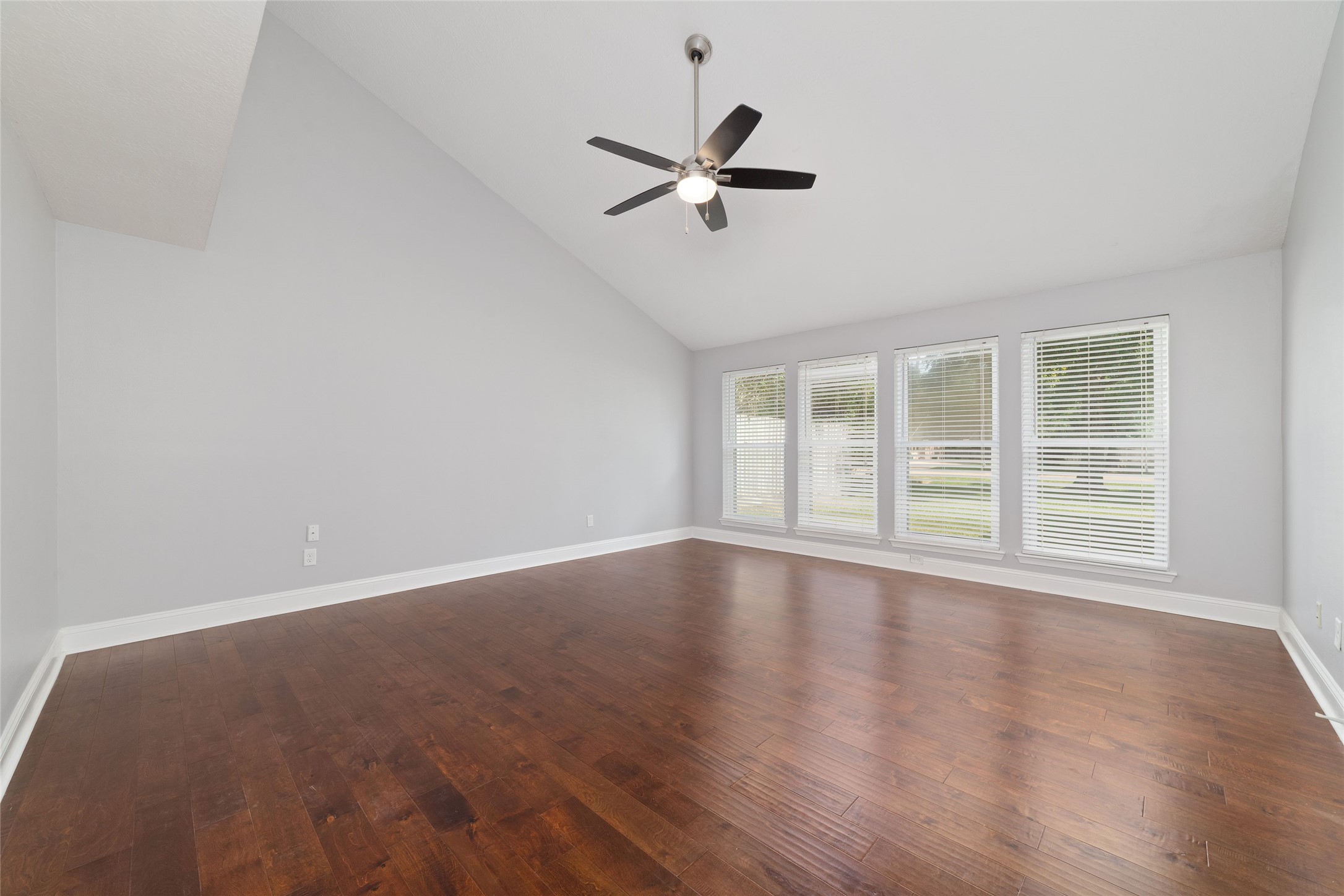 Primary bedroom shown unstaged.