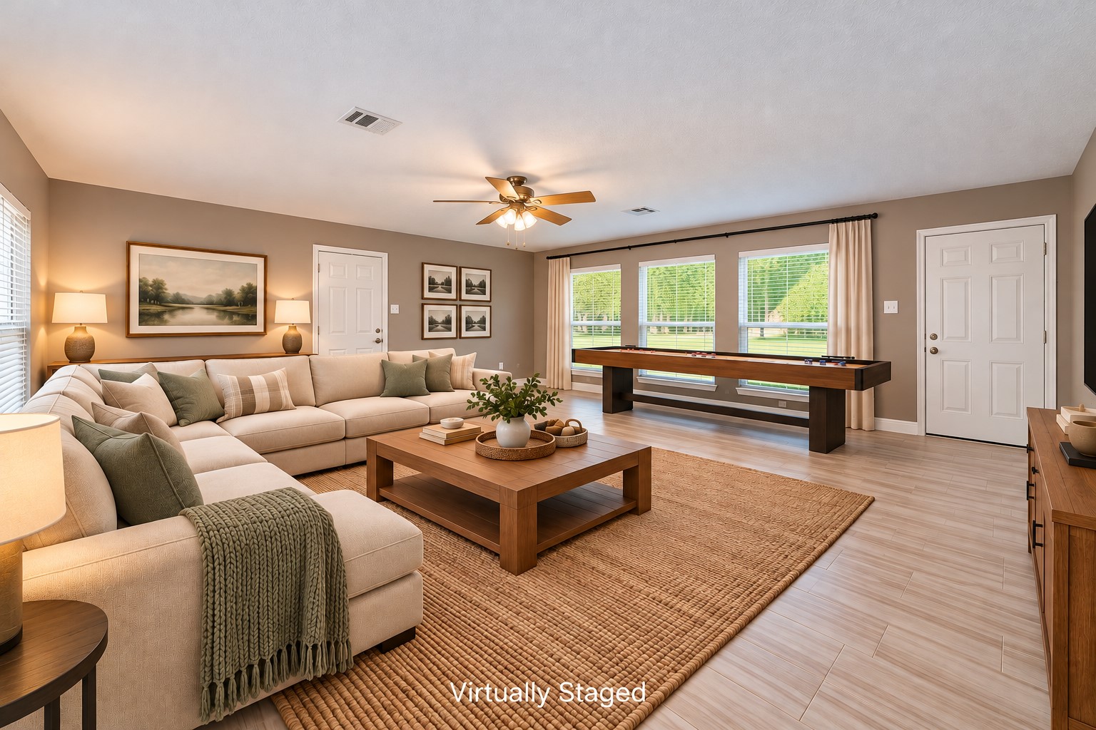 Room to spread out, relax, and make memories! Measuring approximately 20' x 21', this spacious Family Room offers endless possibilitiesfrom movie nights and game days to a casual gathering place or dedicated Gameroom. Originally the home's garage, this thoughtfully converted space features walls of windows overlooking both the front and back yards, filling the room with natural light. A separate oversized 3-car garage was added, so there's no compromise on parking or storage!