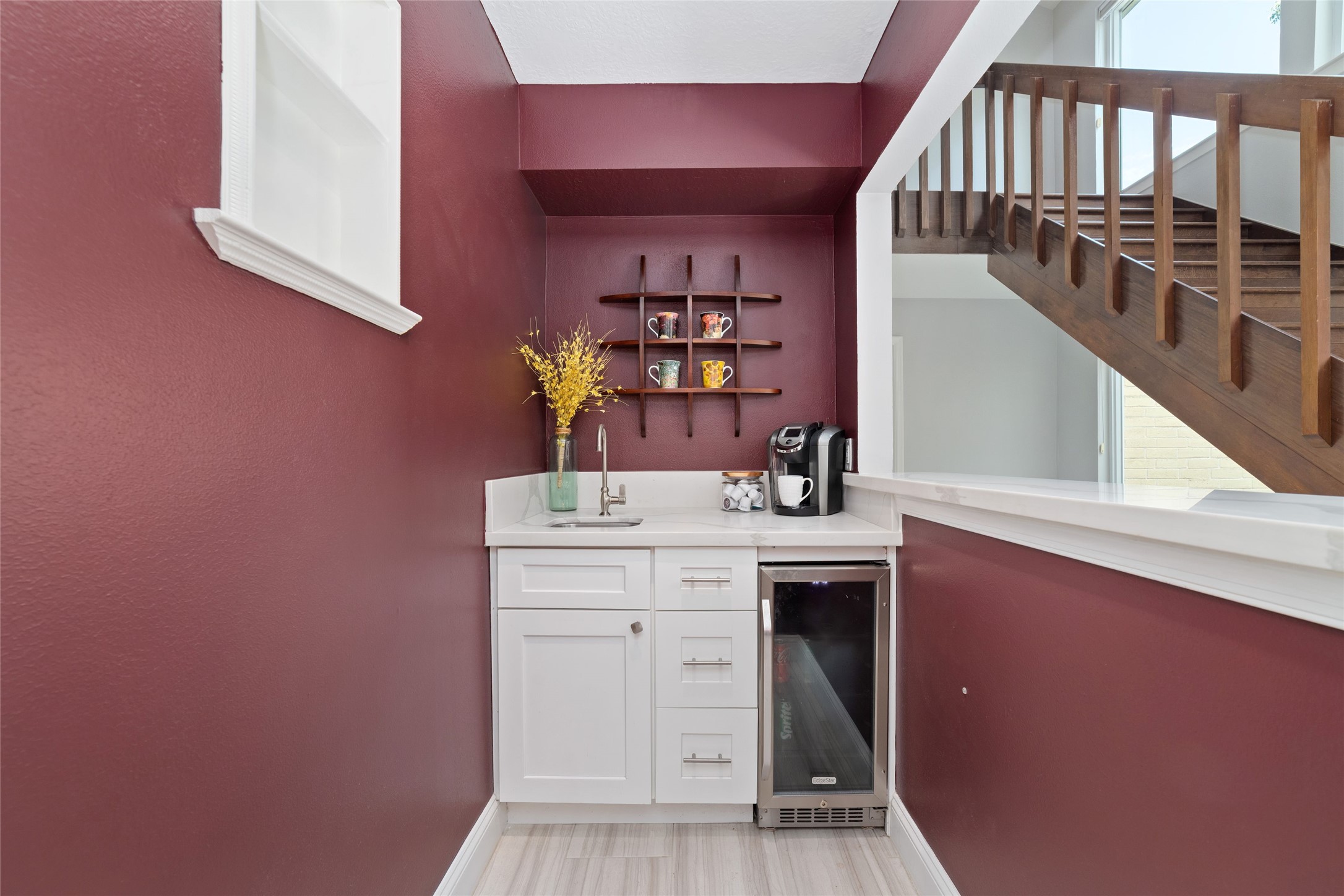 Coffee in the morning, cocktails in the evening! This charming beverage station offers the flexibility to enjoy both. Originally designed as a wet bar, the space features a sink, beverage refrigerator, countertop, and storageperfect for your morning coffee ritual or entertaining friends and family.