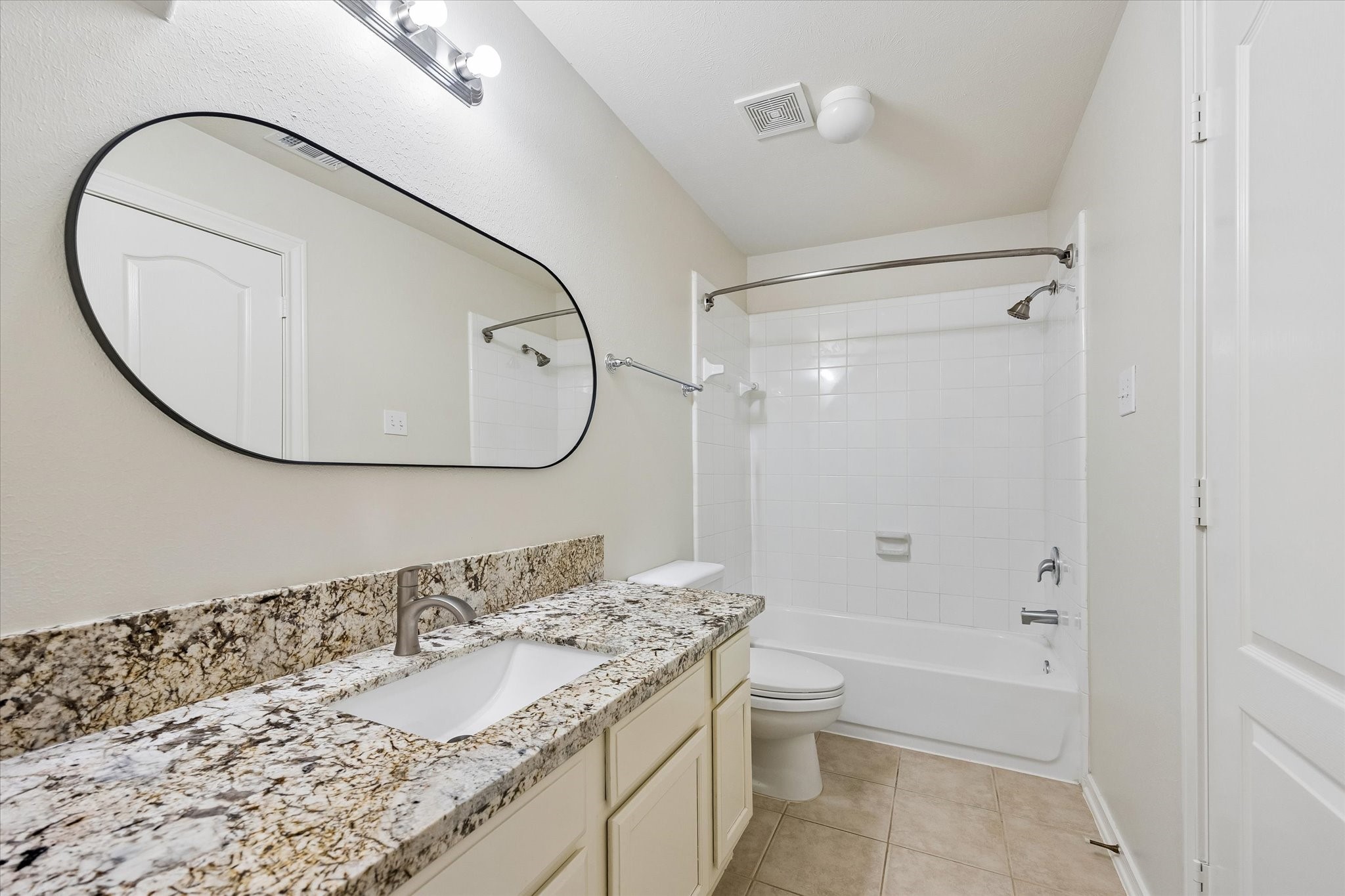 Upstairs bath shared by the Game Room/5th bedroom and bedroom on the right.