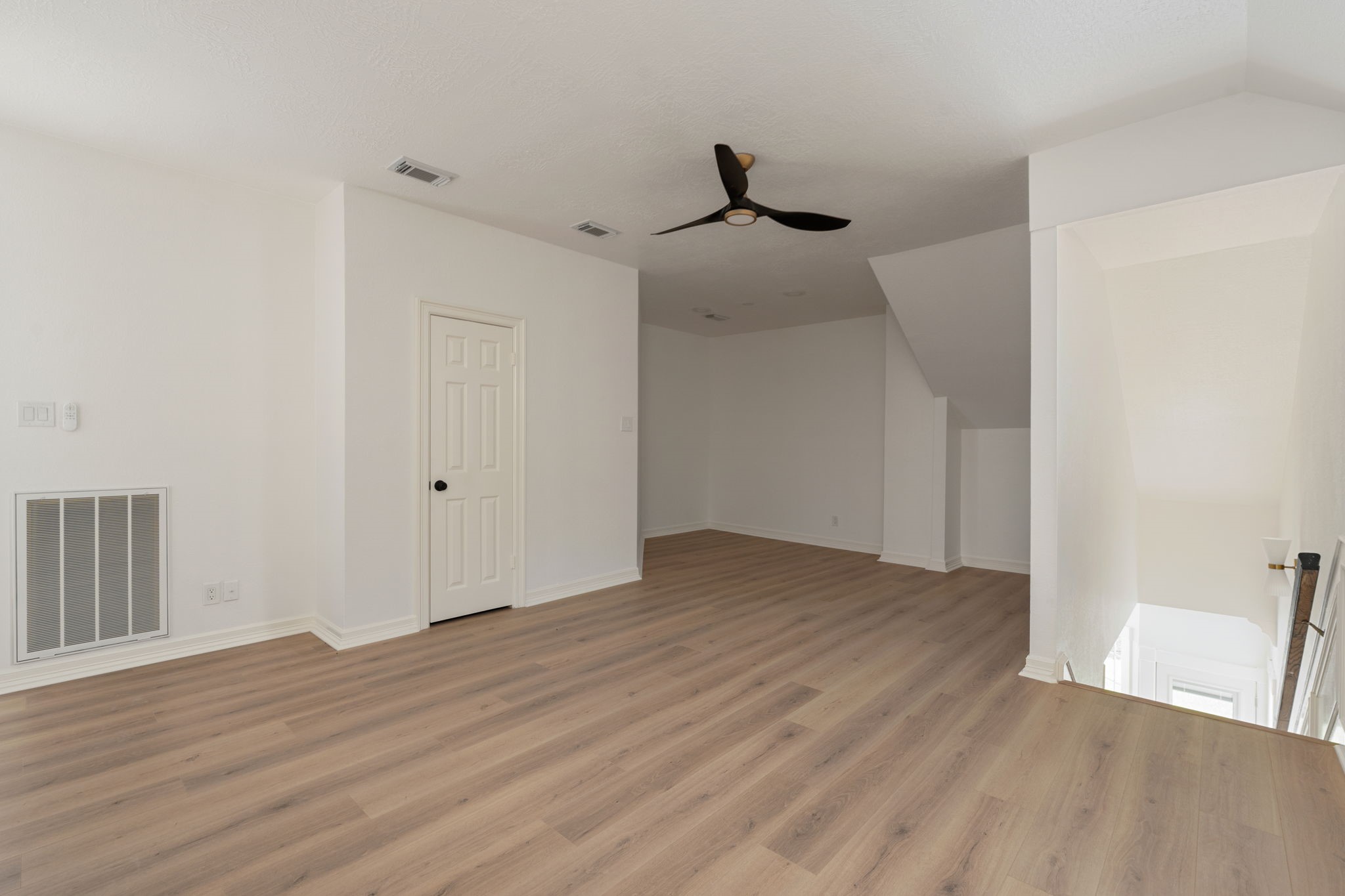 Positioned between the upstairs bedrooms, the flex space provides additional room for everyday living, workspace needs, or entertainment use. Open connections to the surrounding second-floor areas enhance the homes overall flow. Contemporary finishes and natural light continue throughout the space.