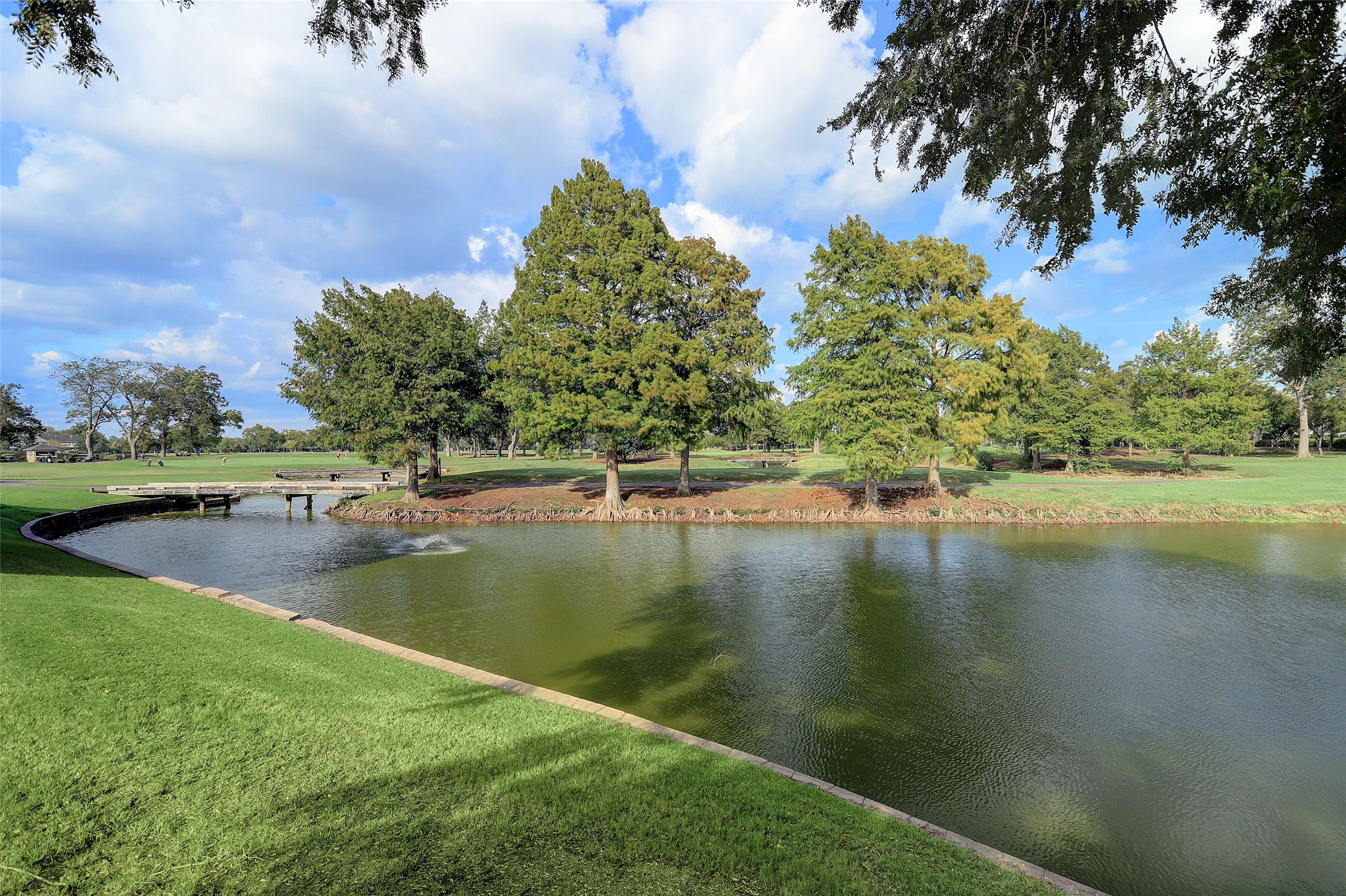 Scenic lakes and landscaped green spaces are woven throughout Sweetwaters golf course community. The neighborhood offers a blend of natural surroundings, walking areas, and country club living in the heart of Sugar Land. Nearby TPC golf courses and recreational amenities contribute to the community lifestyle.