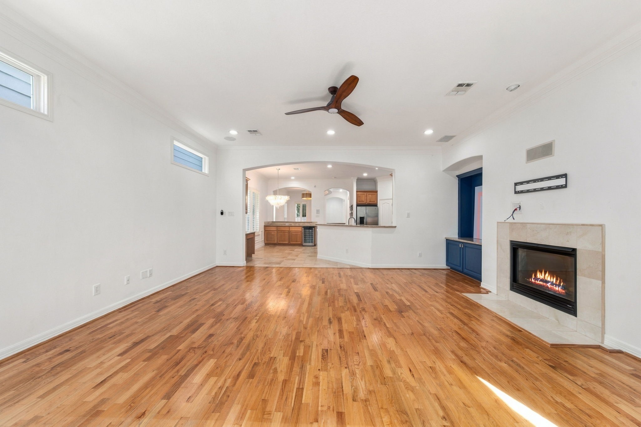 Looking back toward the kitchen and breakfast area, this view highlights the open layout and natural connection between the main living spaces.