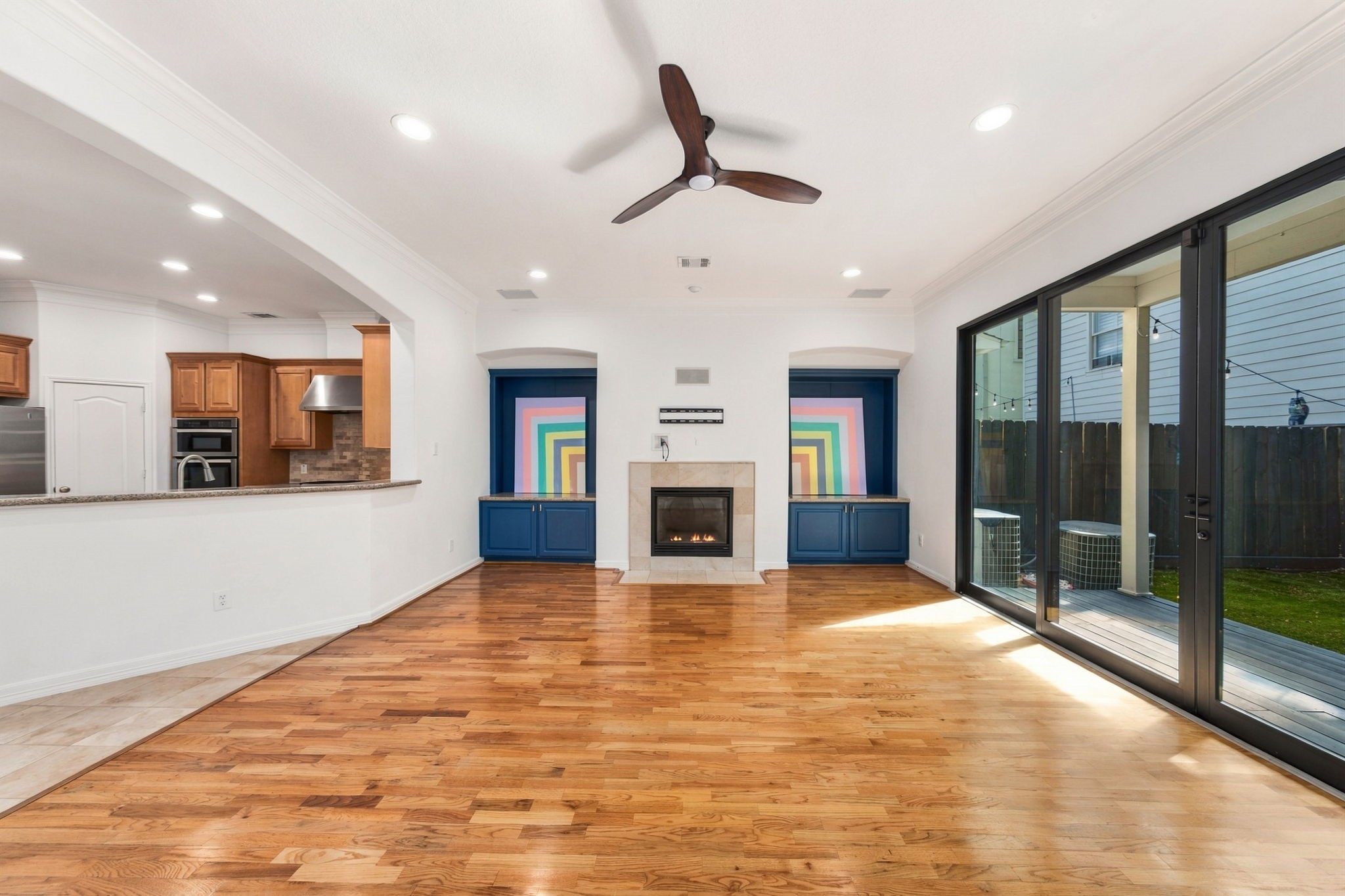 Expansive sliding glass doors bring natural light into the living room and open directly to the covered patio & private backyard.