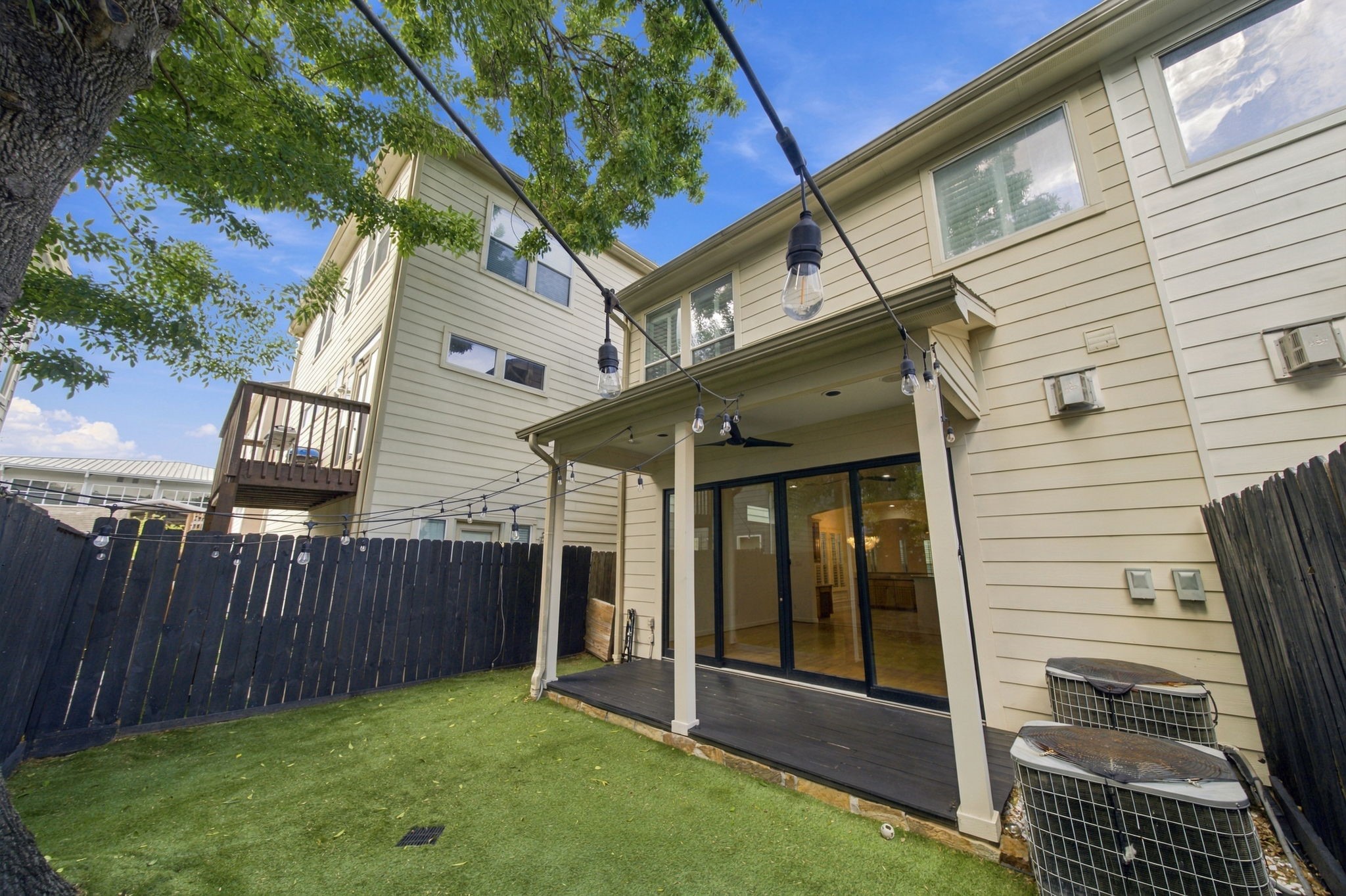 The covered rear patio provides a comfortable setting for outdoor dining or relaxing, complete with ceiling fan & direct access to the living room.