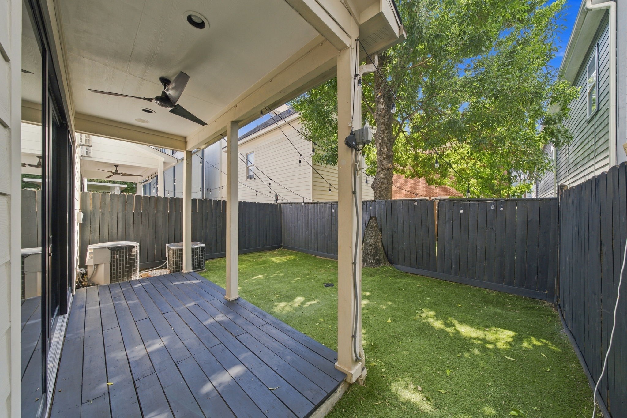 Enjoy the privacy of a fully fenced backyard with low-maintenance turf, mature shade tree & covered patio with ceiling fan.