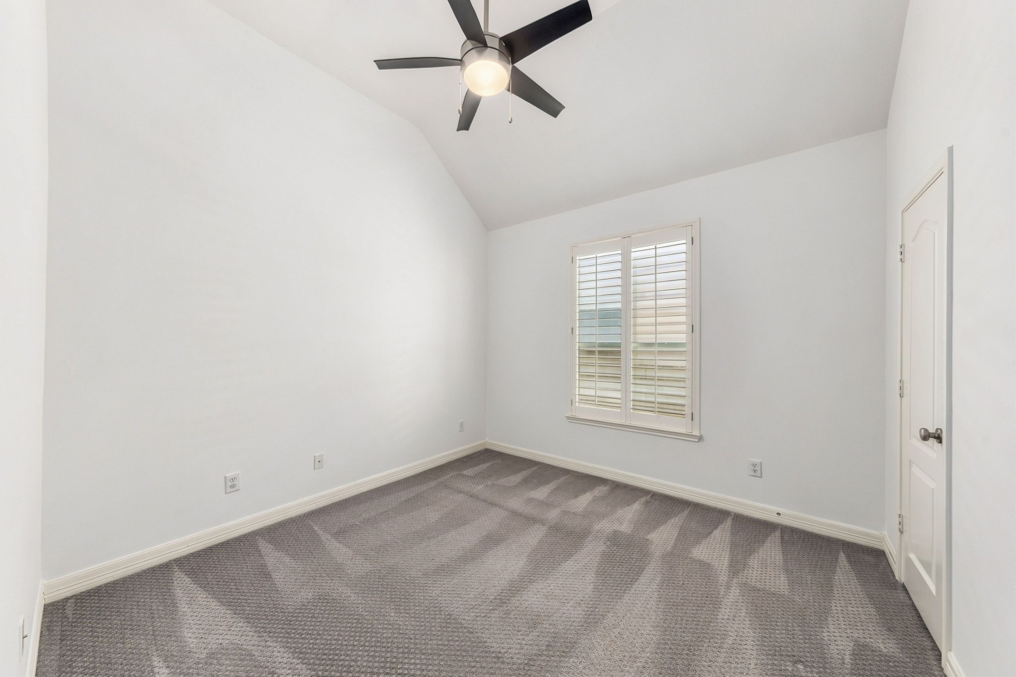 Unstaged view of the preceding bedroom, showing the room without furnishings.