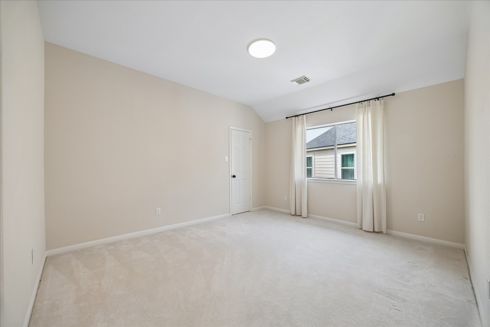 A generously sized secondary bedroom #3 provides a versatile layout with plenty of room to personalize, making it perfect for family or guests.