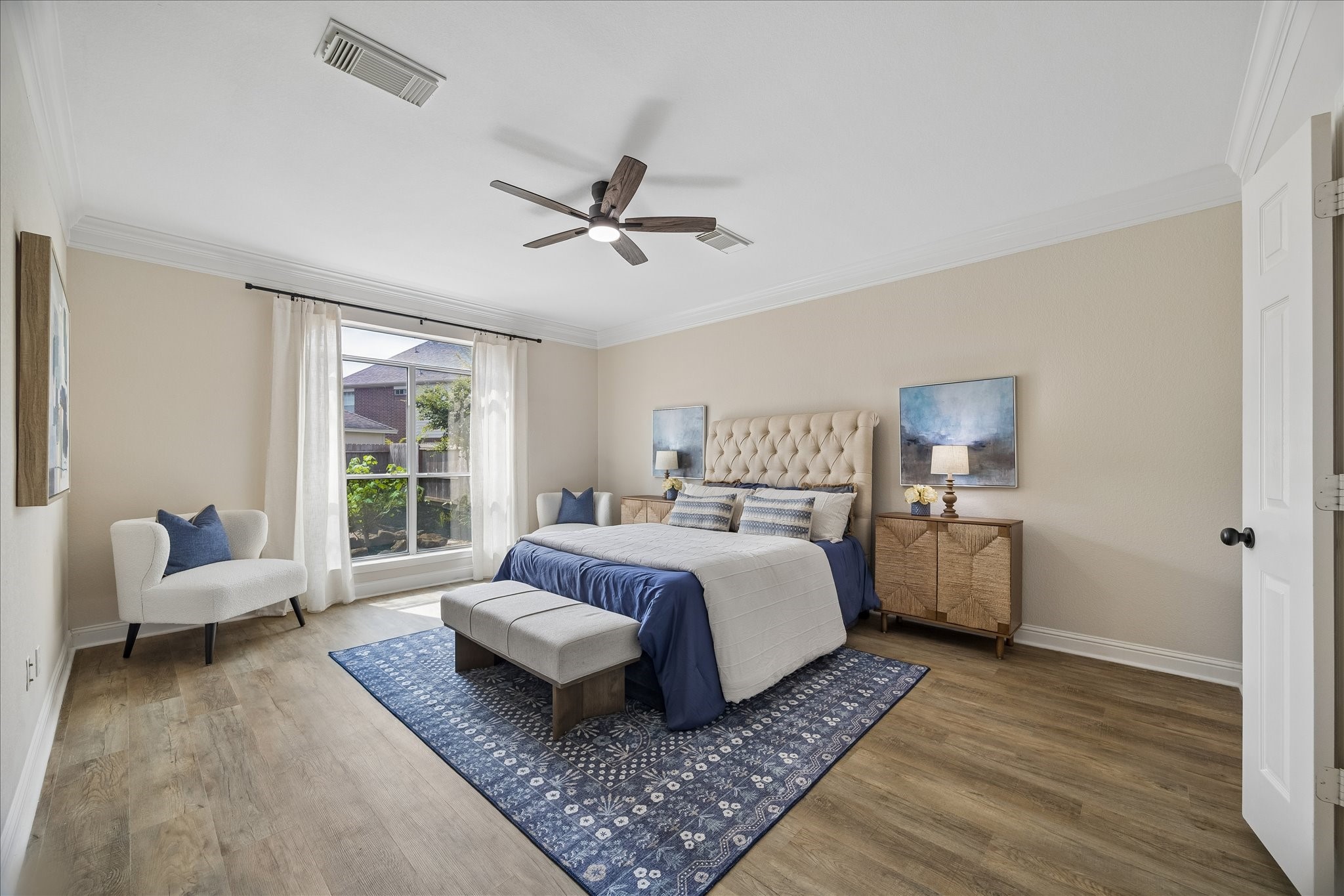 Spacious primary suite overlooks the backyard